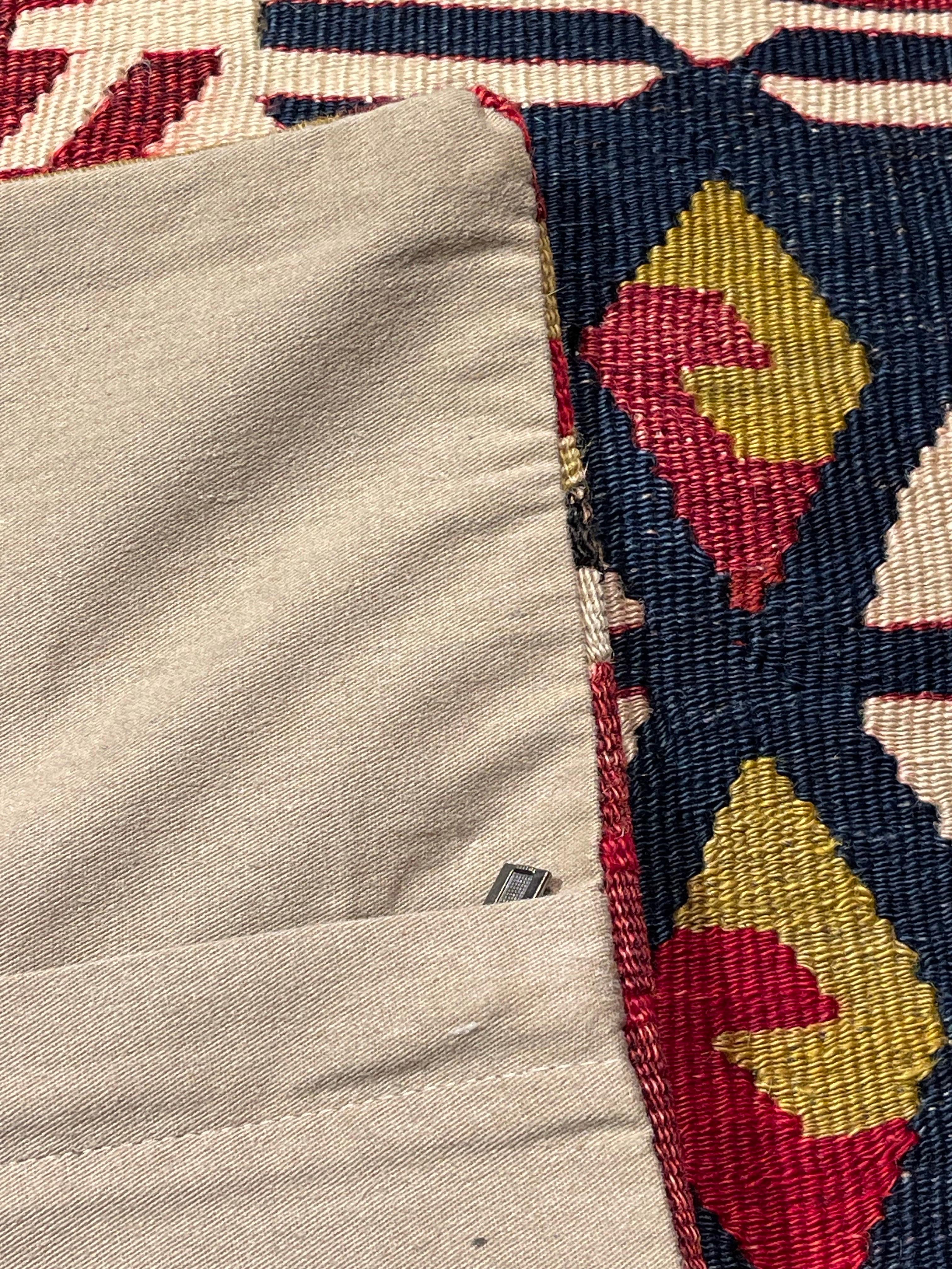 We made a cushion cover using the undamaged parts of the precious and high-quality old & antique kilims that cannot be repaired. Like a painting, a part of the scenery is cut out from a kilim, and even several covers cut out from the same kilim show