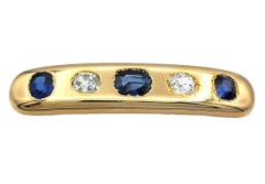 Broche en forme de barre vintage, sertie d'un diamant taille « Old Mine » et d'un saphir bleu, en or jaune 18 carats