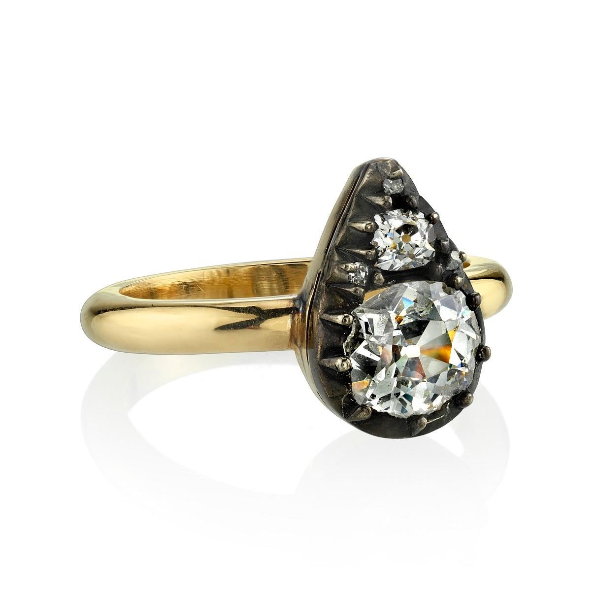 1.25ctw H-I/SI old Mine cut diamonds set in a handcrafted 18k yellow gold ring. Both diamonds are bead set in an oxidized sterling silver head. This piece was converted from a vintage brooch from the late 19th century. 

Ring is currently a size 6
