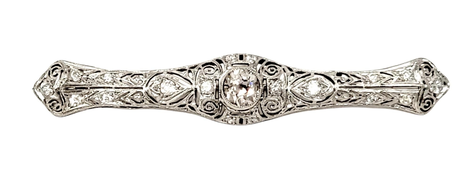 Exquisite vintage bar pin with dazzling diamond details. This gorgeous pin will elevate any look that it is paired with. Add to your favorite jacket, dress or scarf for an instant touch of elegance. The stunning pin features a single Old Mine Cut