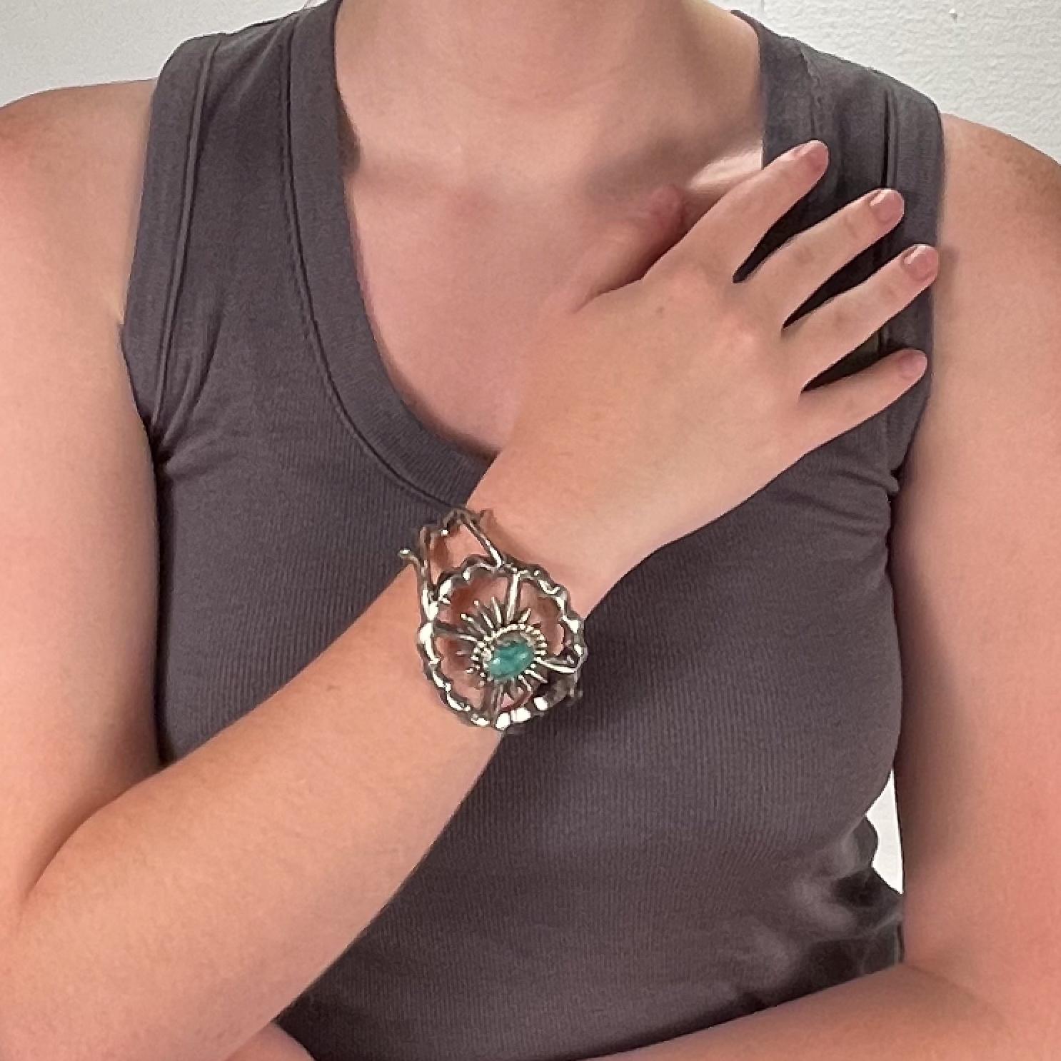 A fine Navajo silver and turquoise cuff bracelet.

Center set with a turquoise cabochon.

Simply a wonderful piece of Old Pawn silver!

Date:
Early 20th Century

Overall Condition:
It is in overall good, as-pictured, used estate condition. There is