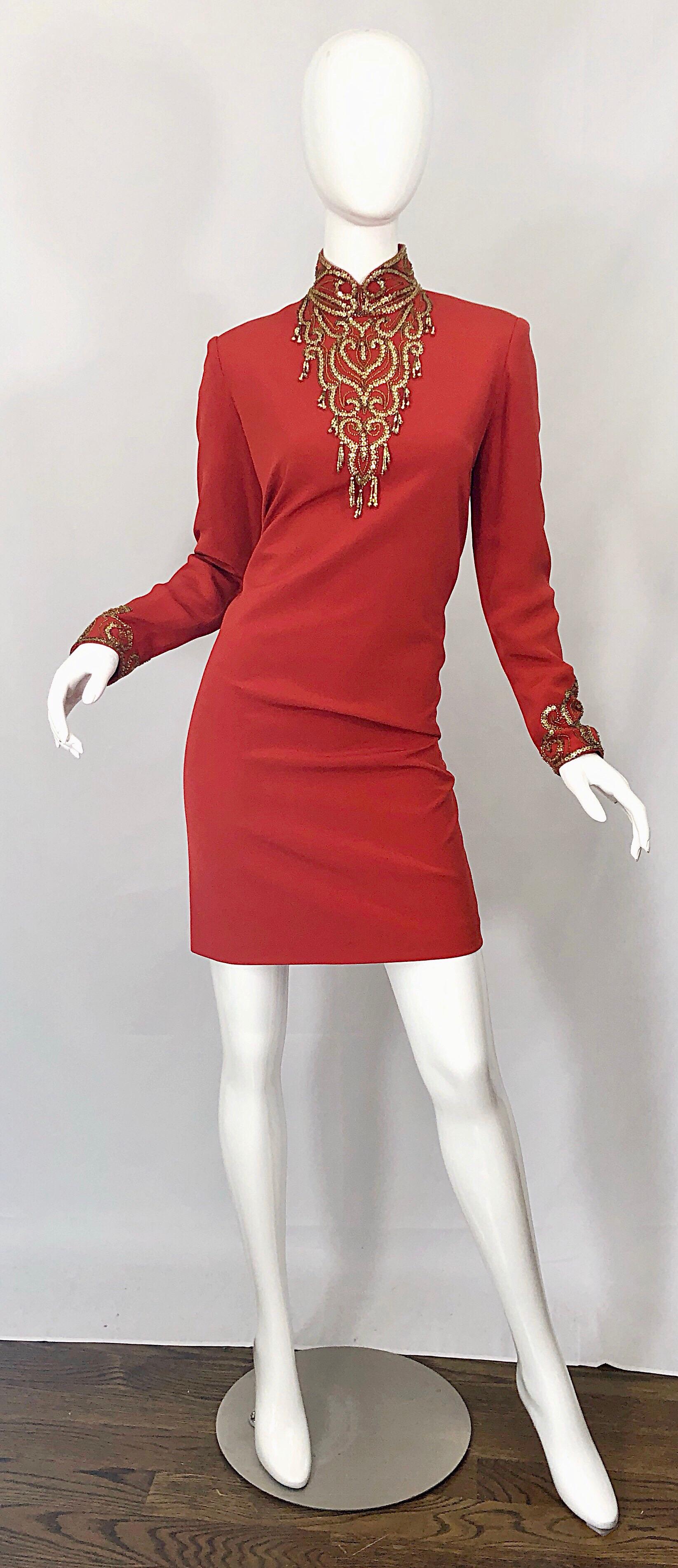 Beautiful vintage OLEG CASSINI burnt orange and gold beaded long sleeve high neck silk cocktail dress! Features hundreds of gold beads around the neck, chest and each sleeve cuff. Chic gold beaded tassels adorn the edges on the chest. Full lined.