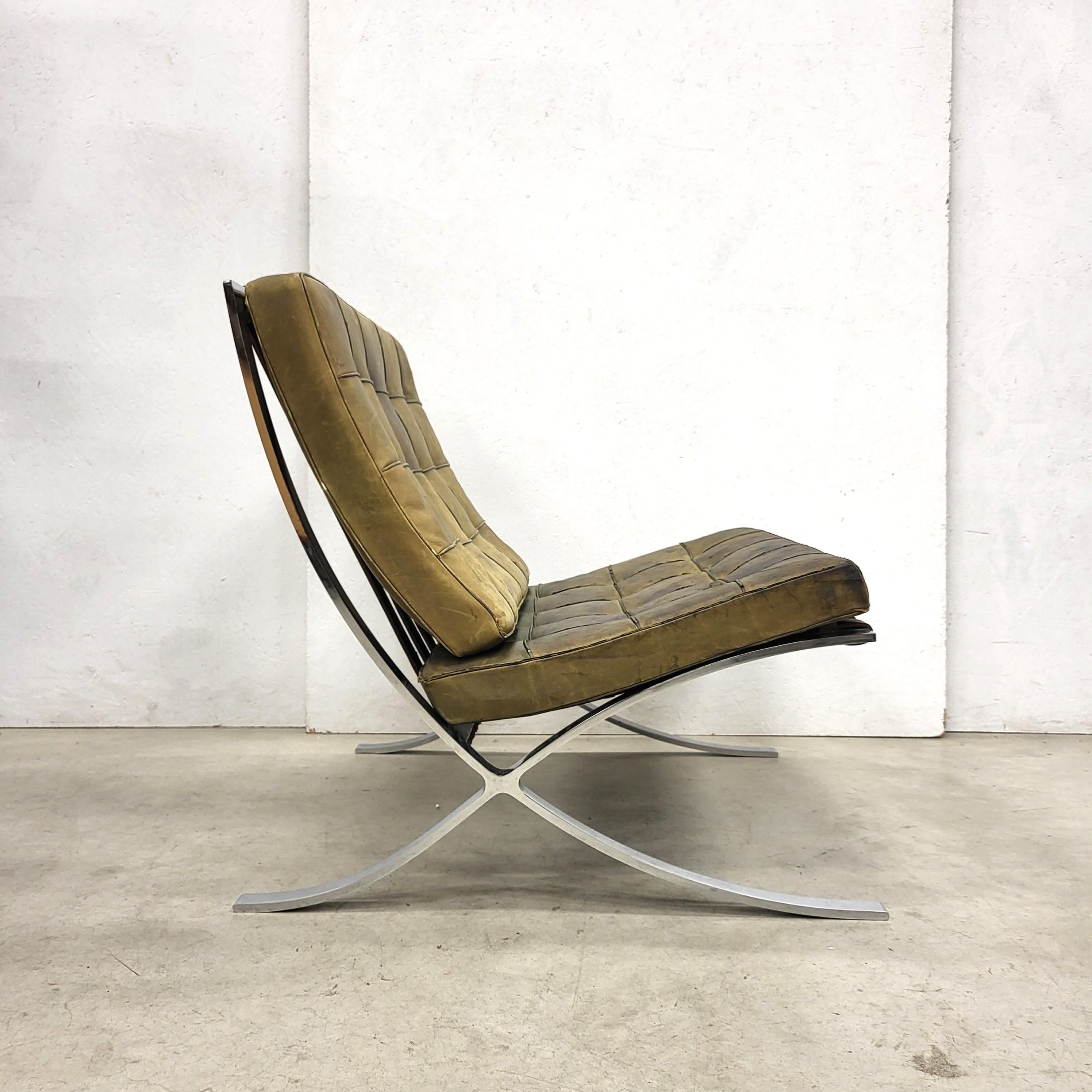 This rare Barcelona chair was designed by Mies van der Rohe in 1929 and produced by Knoll International in the 1970s. 

The piece features an amazing hand dyed olive green leather upholstery with on a chromed steel base. 

The Barcelona chair is in
