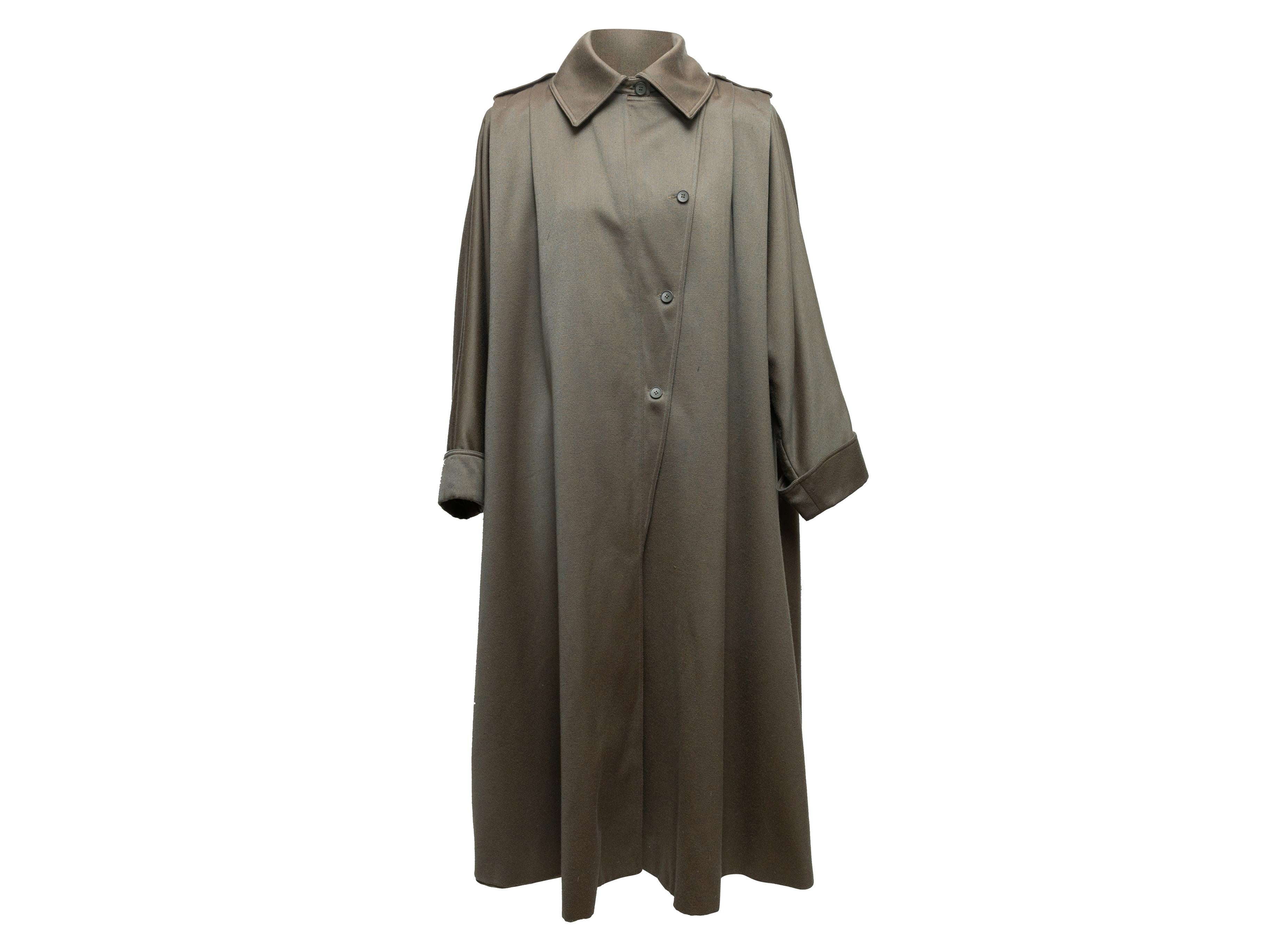Vintage olive long wool swing coat by Hanae Mori. Circa 1970s. Pointed collar. Button closures at front. 66