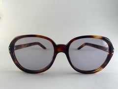 Gafas de sol vintage Oliver Goldsmith de los años 60, color tortoise oscuro y de gran tamaño, fabricadas en Inglaterra