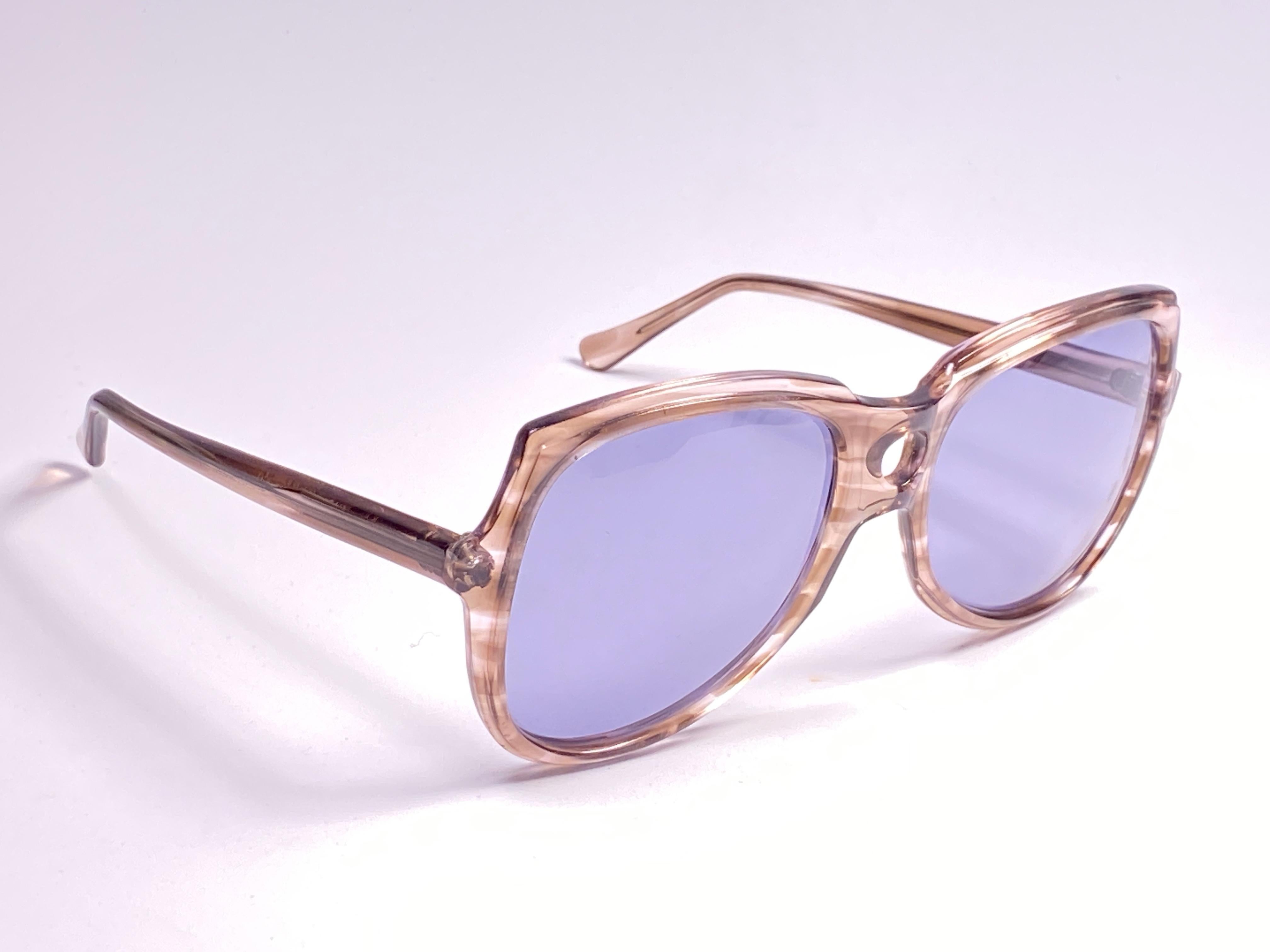 Rare pair of Oliver Goldsmith sunglasses. 
Oversized translucent grey undertones frame holding a pair of medium blue lenses.   

 This pair have minor sign of wear due to storage.

Handmade in England.