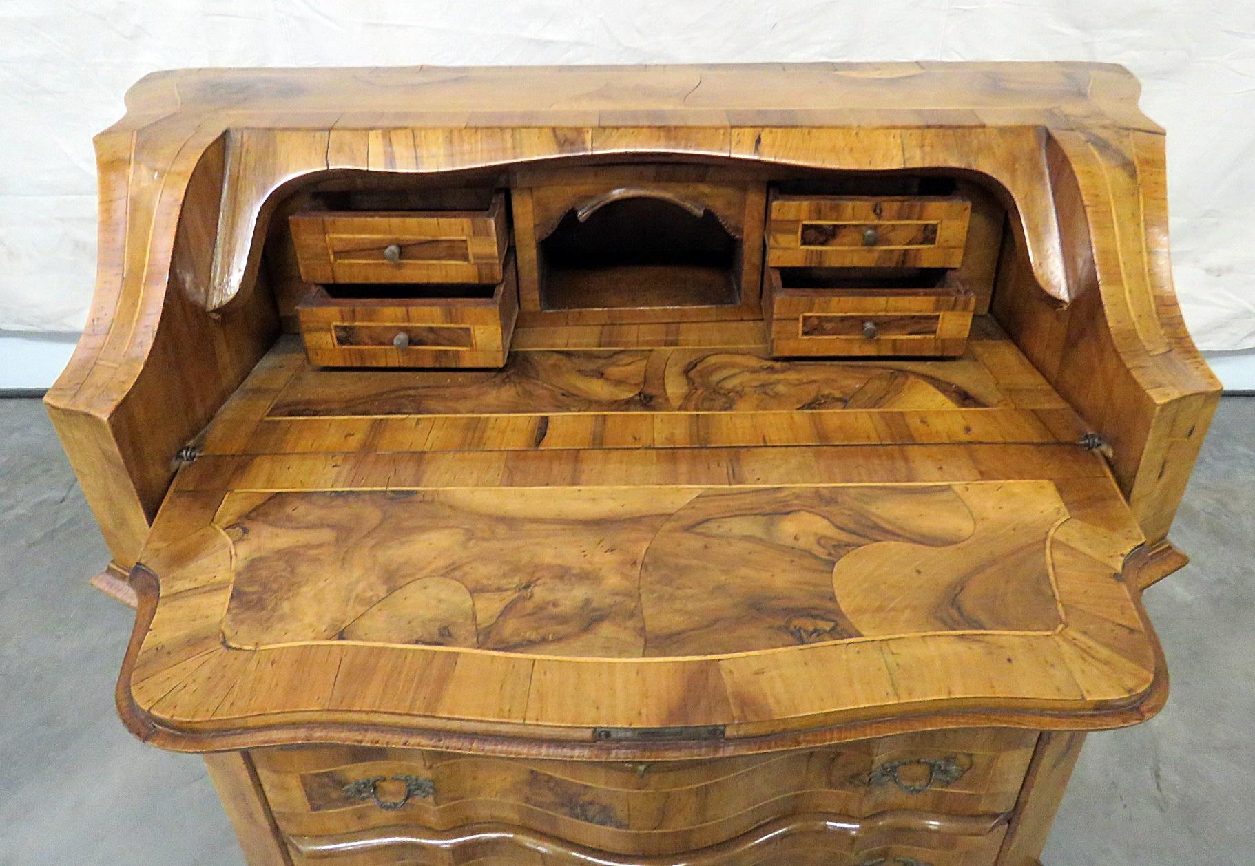 Vintage olivewood secretary desk with a drop down desk containing 4 drawers over 3 drawers. The desk is 24