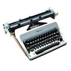 Vintage Olympia De Luxe Portable Typewriter with Carrying Case