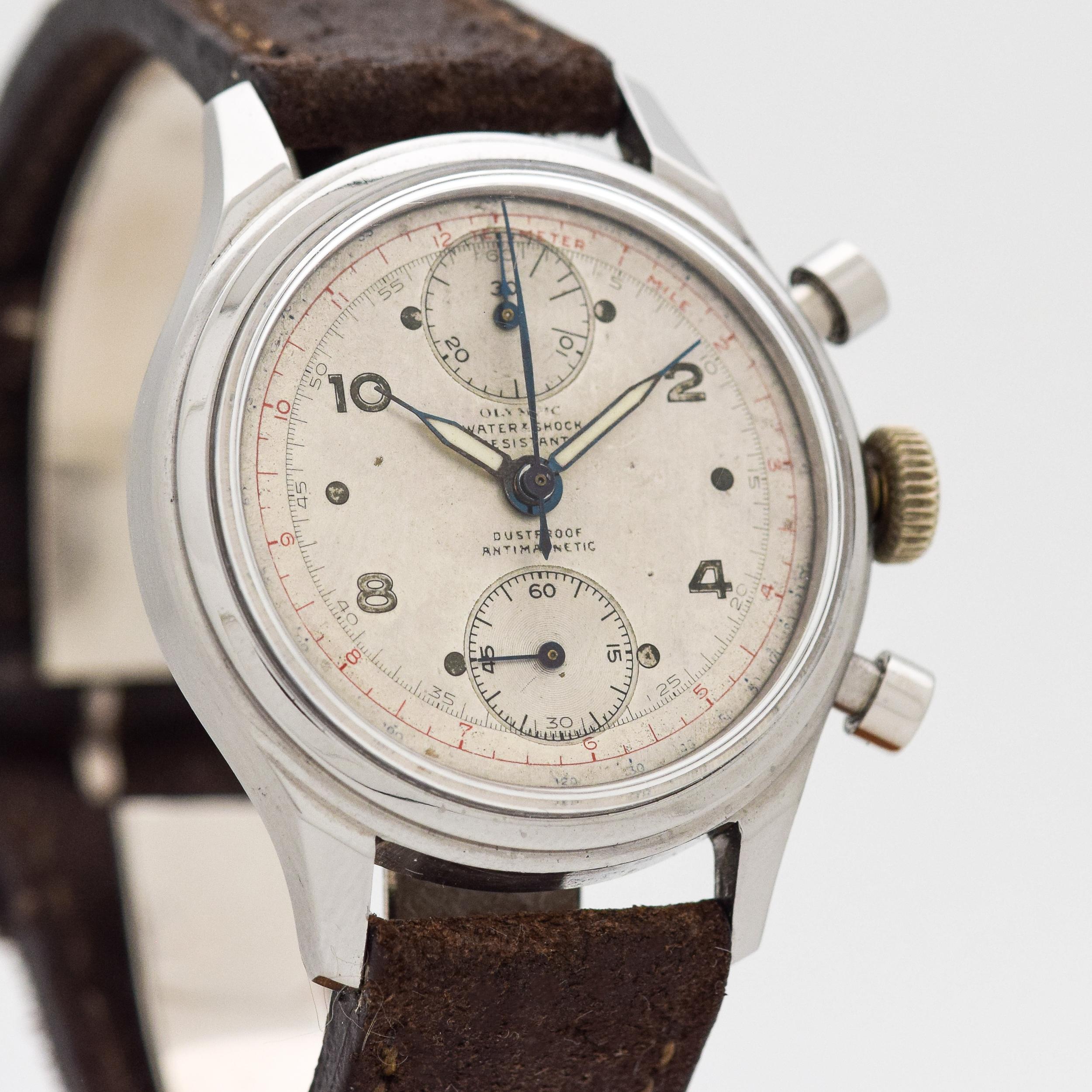 1950's Vintage Olympic 2 Resister Chronograph Stainless Steel watch with Original Silver Dial with Luminous Arabic 2, 4, 8, 10, and 12 Markers. 36mm x 43mm lug to lug (1.42 in. x 1.69 in.) - 17 jewel, manual caliber movement. Equipped with a Triple