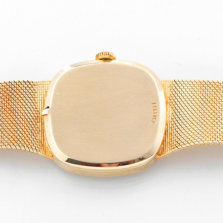 Vintage Omega 14k Yellow Gold Men's  Dress Watch - Manual winding . 14k yellow gold textured case (32mm diameter). Gold textured dial with stick markers. Integrated 14k yellow gold mesh bracelet (will fit apx. 7-1/2 in. wrist). Pre-owned with custom