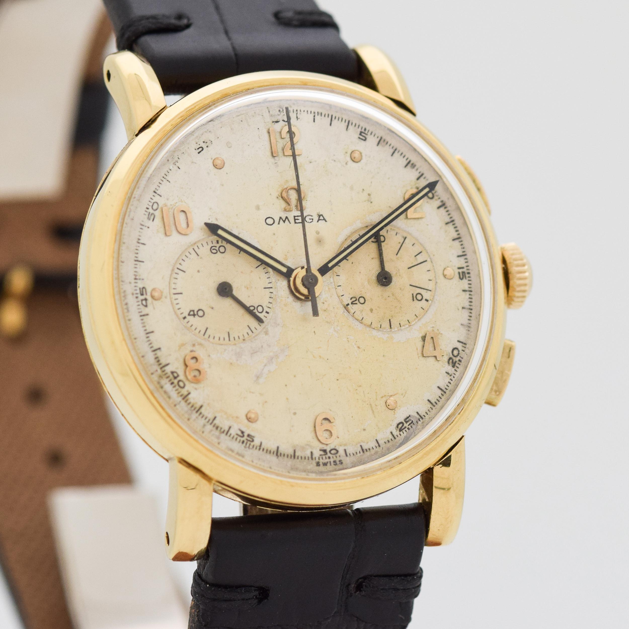1945 Vintage Omega 2 Register Chronograph 18k Yellow Gold with Original Silver Dial with Applied Gold Arabic 2, 4, 6, 8, 10, and 12 and Dot Markers. 34mm x 40mm lug to lug (1.34 in. x 1.57 in.) - 17 jewel, manual caliber 320-T1-PC movement. Featured
