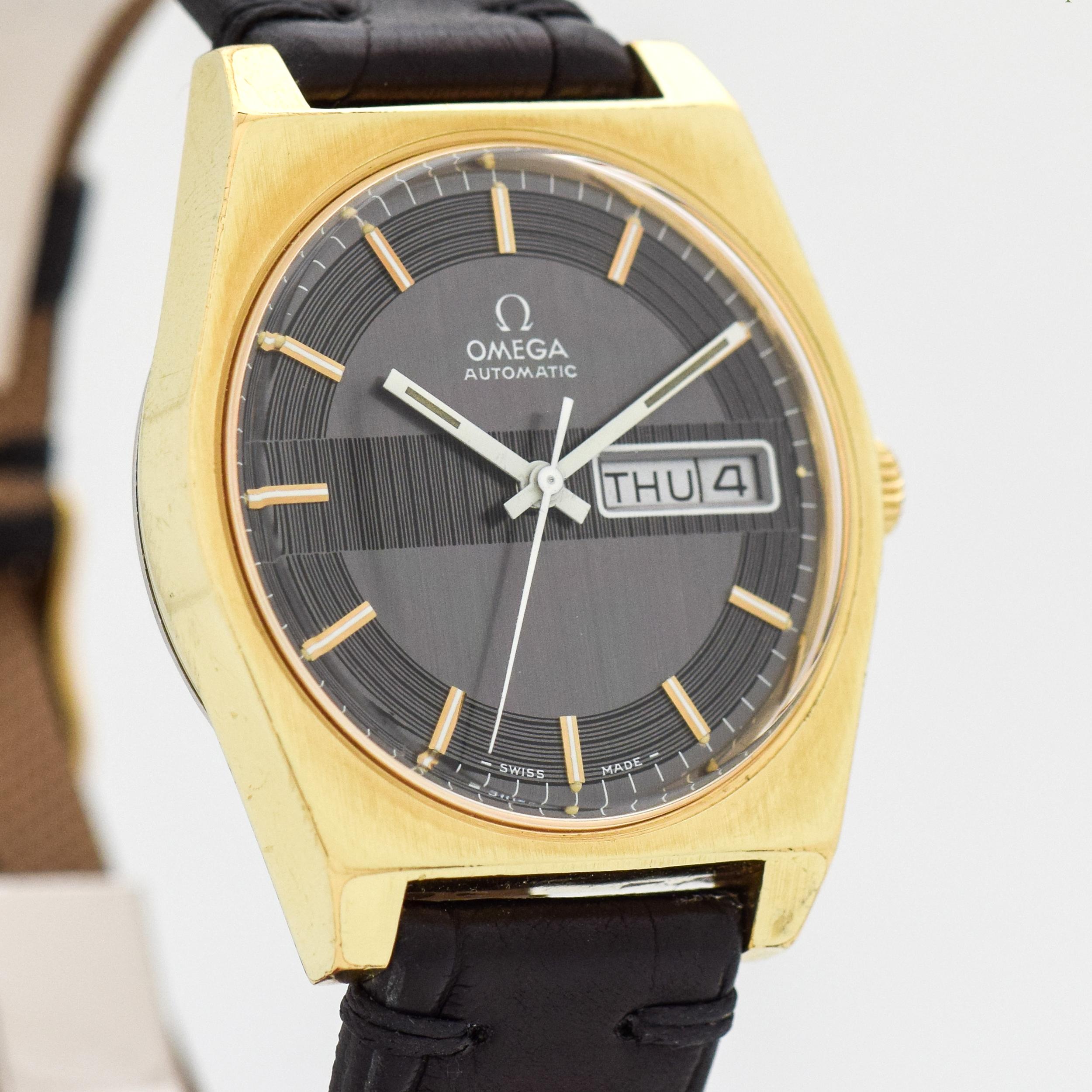 1970 Vintage Omega Rare Day-Date Automatic Ref. 166.0141 18k Yellow Gold Plated and Stainless Steel watch with Original Black Unique Dial with Applied Gold Color Stick/Bar/Baton Markers with White Inlay. 36mm x 42mm lug to lug (1.42 in. x 1.65 in.)