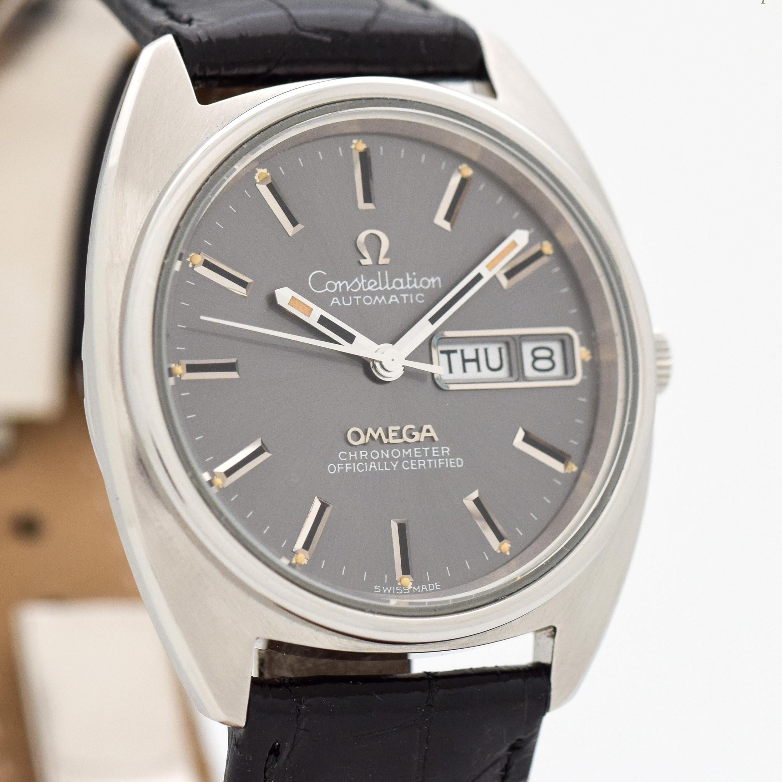1973 Vintage Omega Constellation Chronometer Day - Date Ref. 1680064 Stainless Steel watch with Original Gray Dial with Applied Steel Beveled Stick/Bar/Baton Markers with Gray Inlay. 35mm x 40mm lug to lug (1.38 in. x 1.57 in.) - 23 jewel, automatic
