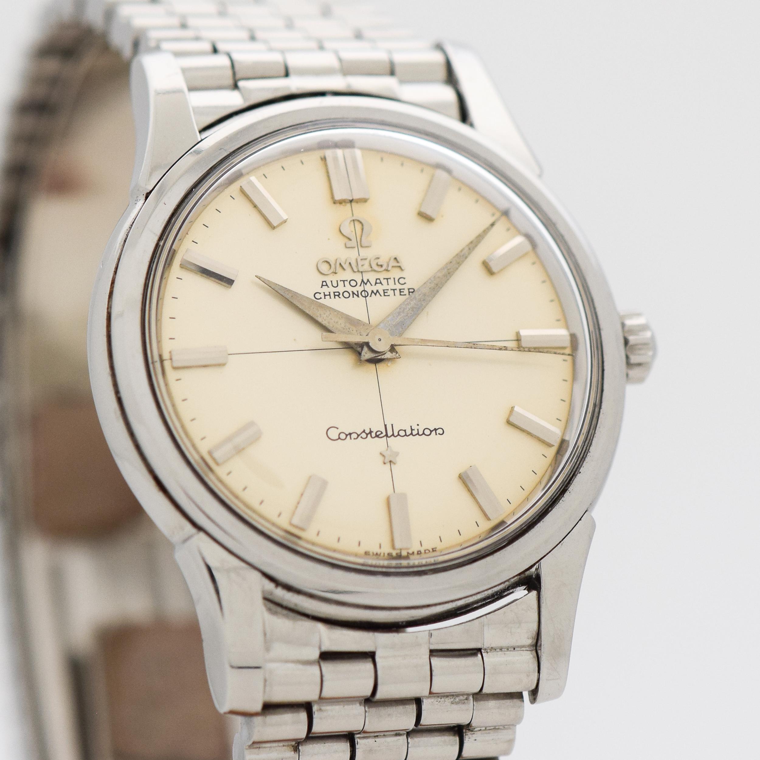1961 Vintage Omega Constellation Ref. 14381-11-SC Stainless Steel watch with Original Silver Dial with Applied Steel Beveled Bar Markers with Original Omega Stainless Steel Bracelet. 34mm x 43mm lug to lug (1.34 in. x 1.69 in.) - 24 jewel, automatic