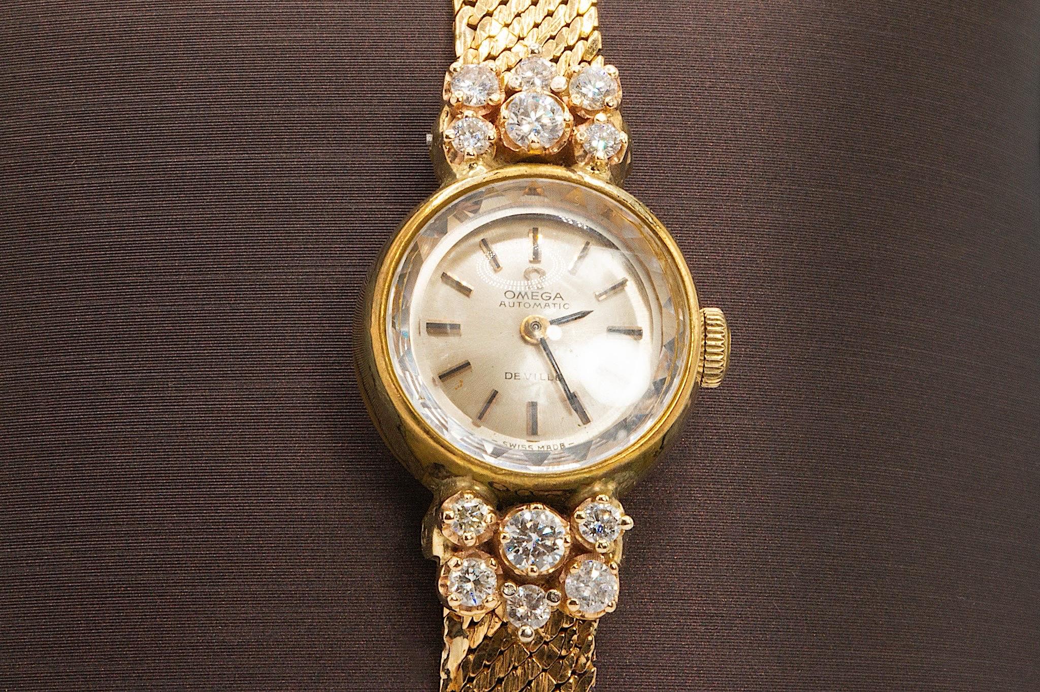 Vintage Omega De Ville Diamond Watch in 18K Yellow Gold  0.75 ctw

A graceful blend of elegance and craftsmanship, this vintage Omega De Ville ladies’ watch is crafted in rich 18K yellow gold and features a manual wind movement that runs