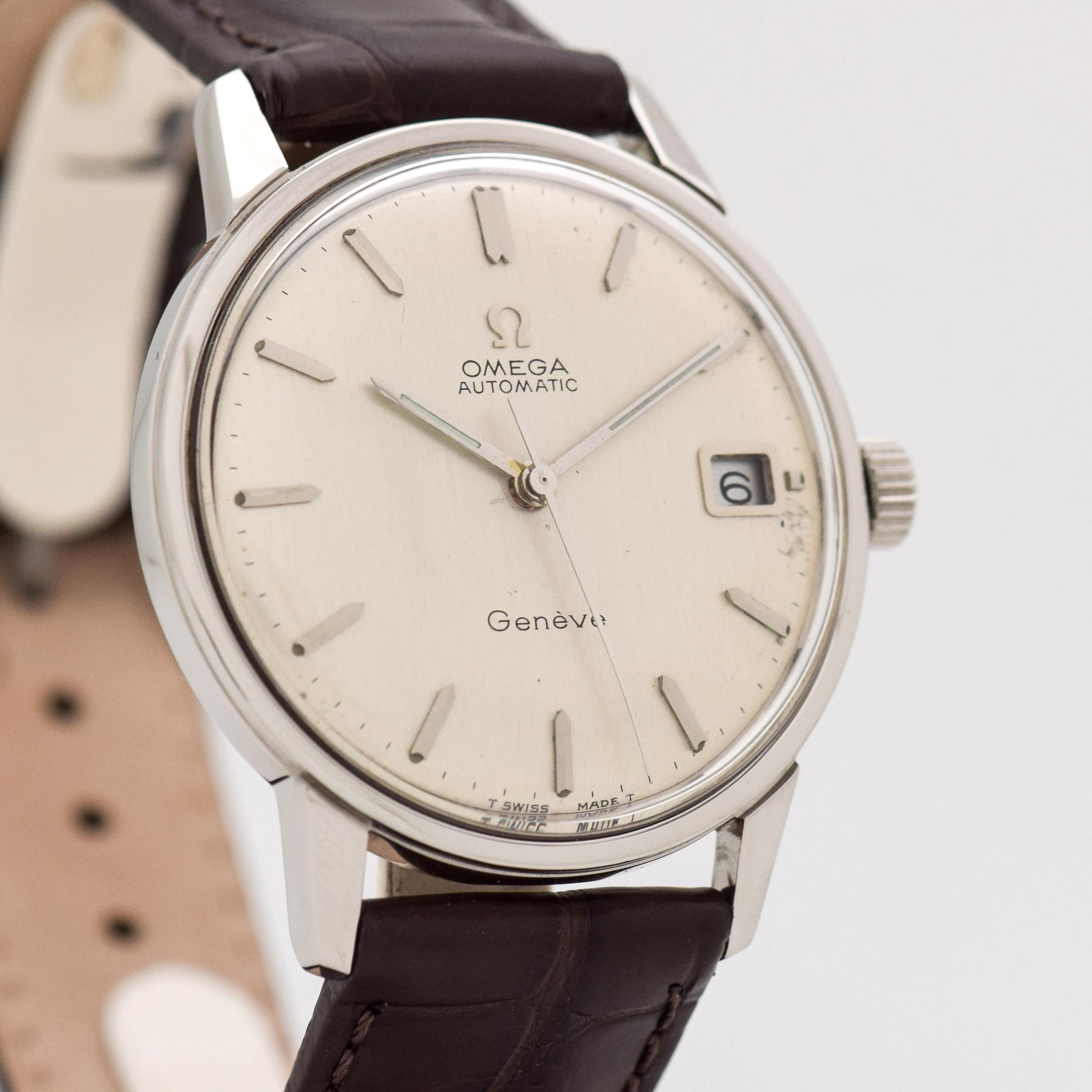 1968 Vintage Omega Geneve Ref. 166.037 Stainless Steel Automatic Date watch with Original Silver Dial with Applied Steel Beveled Pointed Tip Stick/Bar Markers. 34mm x 40mm lug to lug (1.34 in. x 1.57 in.) - Powered by a 17-jewel, automatic caliber