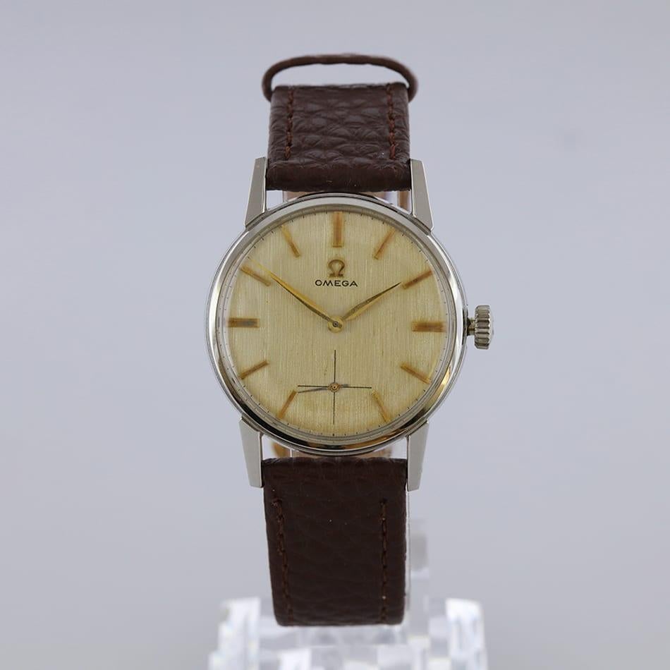 This is a vintage Omega manual stainless steel watch with crosshair sub dial at six o'clock. Featuring a round yellow dial with raised hour batons and golden minute & hour hands and a crosshair sub dial.



Condition: Used (Very Good – Few scratches