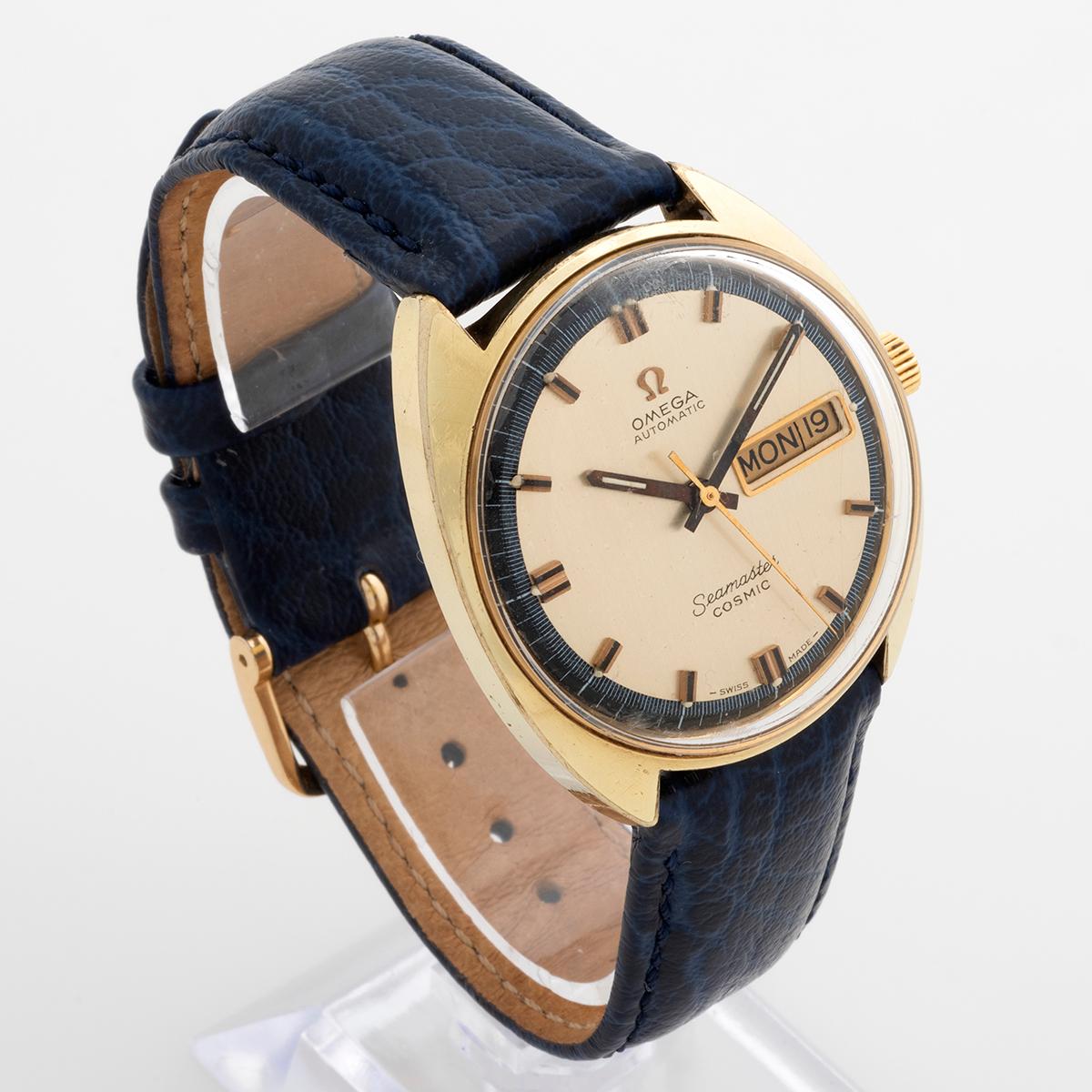 Our vintage Omega Seamaster Cosmic automatic reference 166.036 features a gold capped 35mm case with desirable champagne dial with blue inner bezel. There are some signs of use to the case and light patination to the original dial. A superb vintage