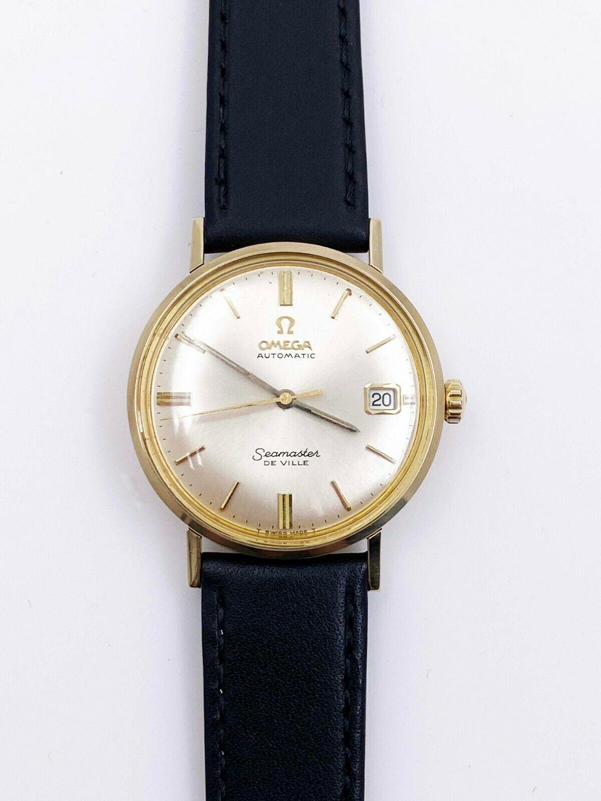 Model: Omega Seamaster De Ville

 

Case Material: Stainless Steel

 

Band: Custom Leather Band

 

Bezel: 14K Yellow Gold

 

Dial: Champagne

 

Face: Sapphire Crystal

 

Case Size: 34mm

 

Includes: 

-Elegant Watch Box

-Certified Appraisal