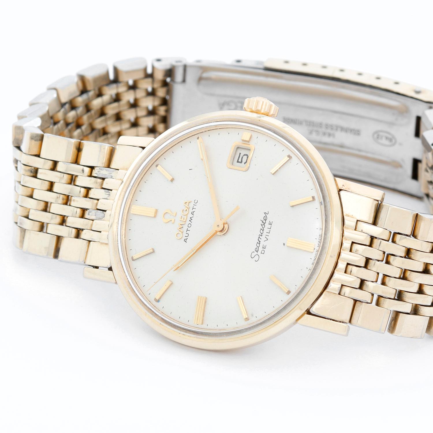 Vintage Omega Seamaster De Ville Mens Watch  - Automatic winding. Gold plated case (34 mm) . Silver dial with gold stick markers; date at 3 o'clock position. Gold plated bracelet . Pre-owned with custom box. Circa 1960's.
