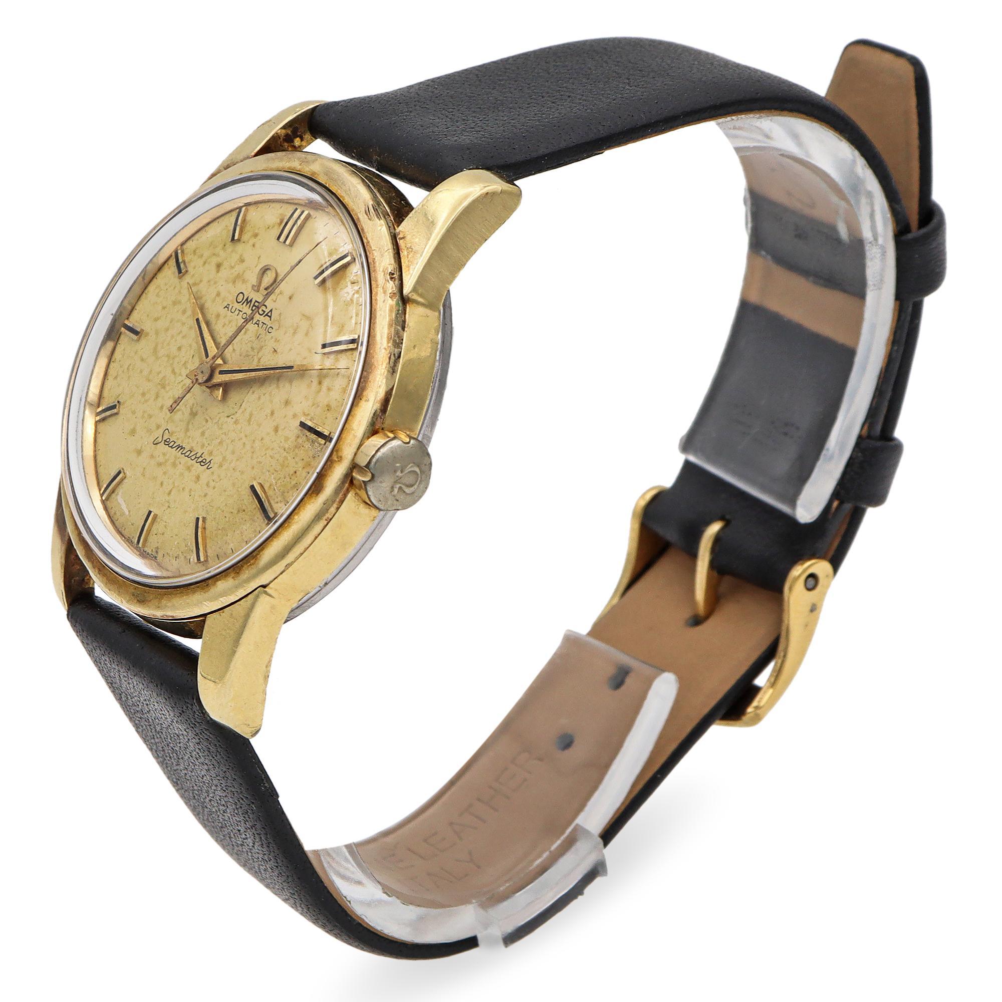 The Omega Seamaster Automatic Watch is a timeless masterpiece of sophistication and precision. Its distinguished gold-toned case exudes classic elegance, while the subtly aged dial adds depth and character. Sleek hour markers and hands enhance its