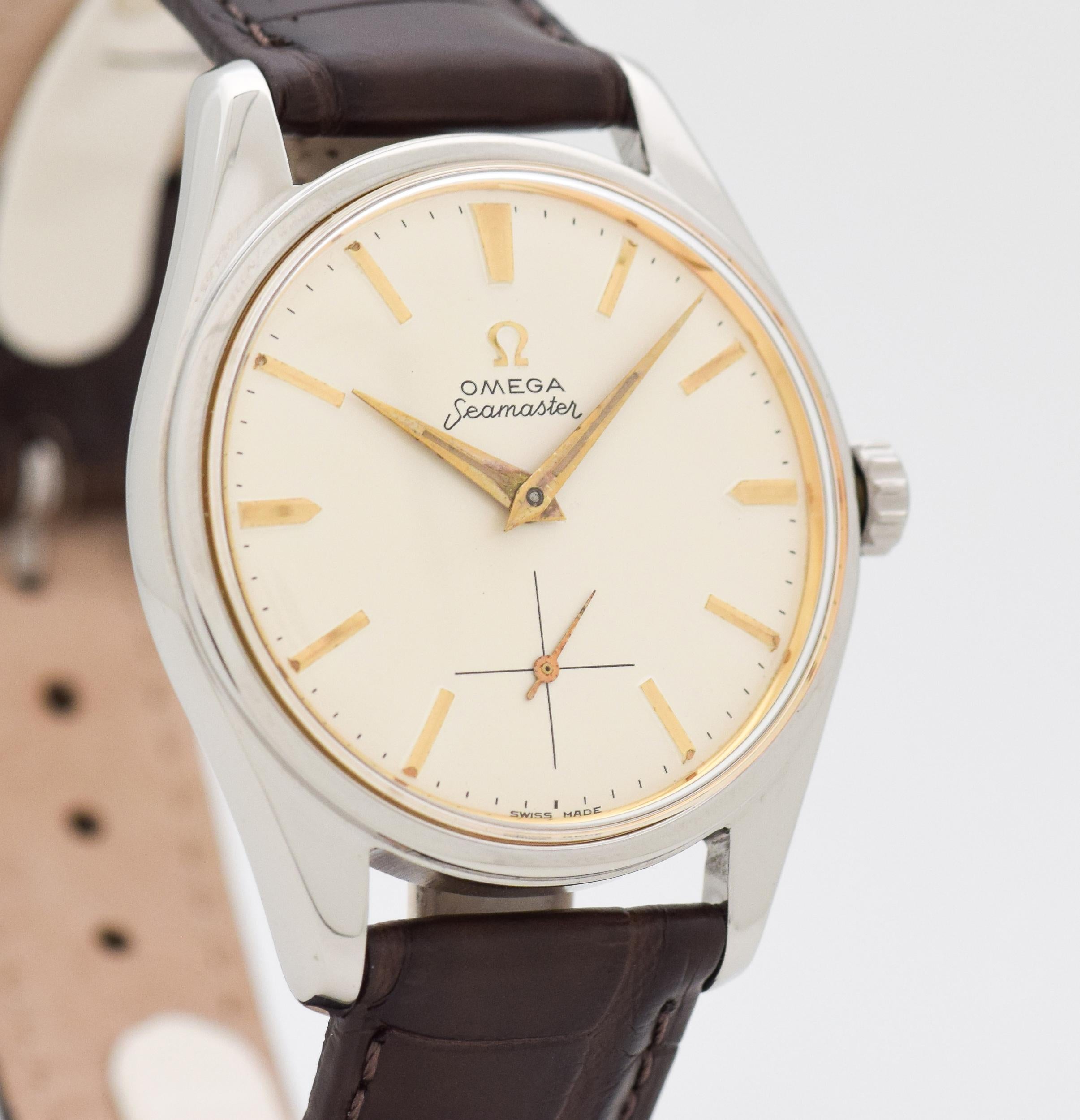 1948 Vintage Omega Seamaster Ref. 2990-1 Ranchero Reference Number Stainless Steel watch with Silver Dial with Applied Gold Color Beveled Stick/Bar/Baton Markers. Case size, 36mm wide. Triple Signed.