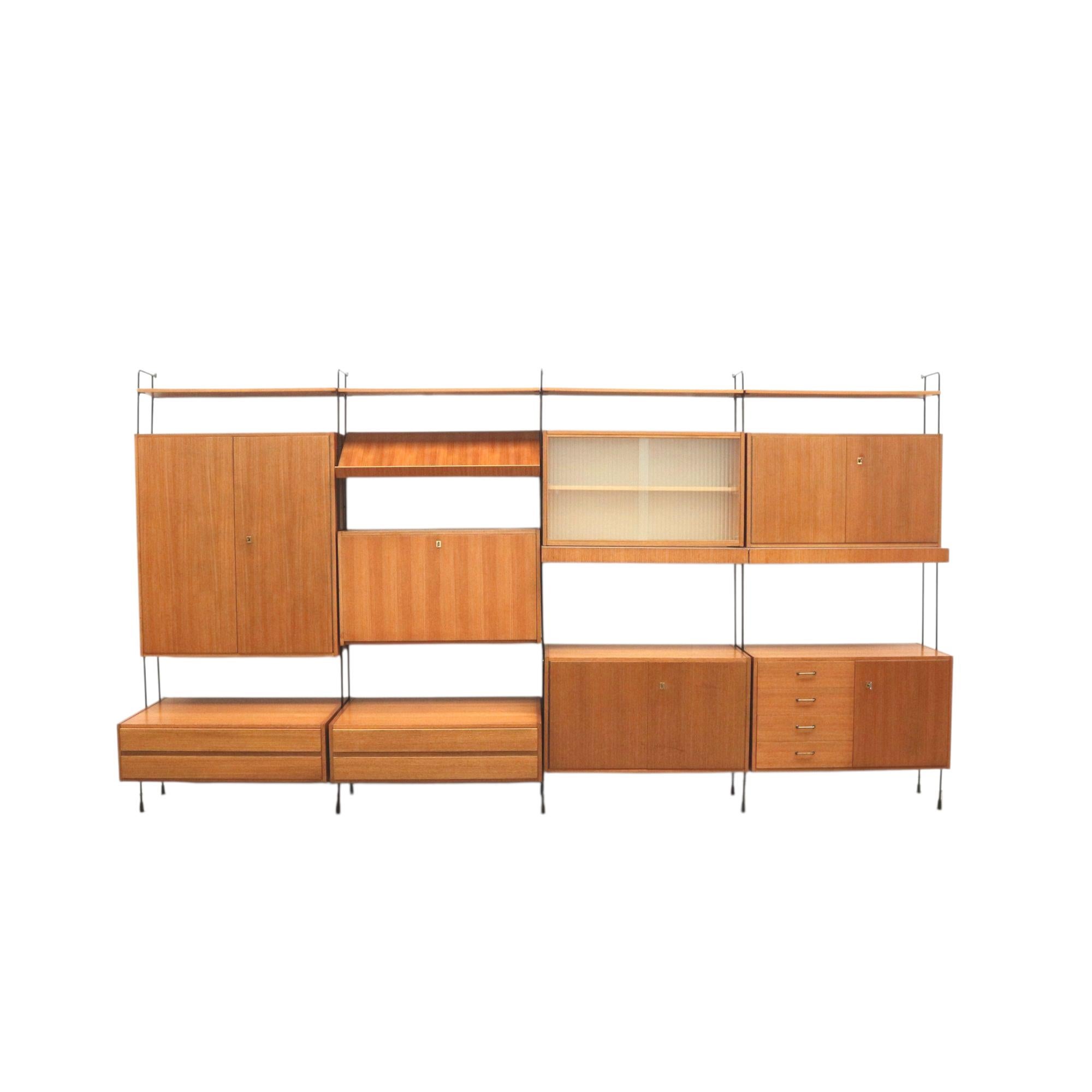 Vintage Omnia wall system designed by Ernst Dieter Hilker in the 1960s.

Looking for an original vintage wall unit from the 1960s? This Omnia cabinet, designed by Ernst Dieter Hilker, is a beautiful example of mid-century modern design. A real