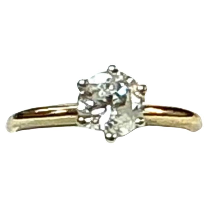 Bague solitaire ancienne en diamant rond jaune 14k, 2.30 grammes TW. Les dimensions du solitaire sont d'environ 6,4 mm. Le solitaire est d'environ un carat. Testé pour 14k. 
