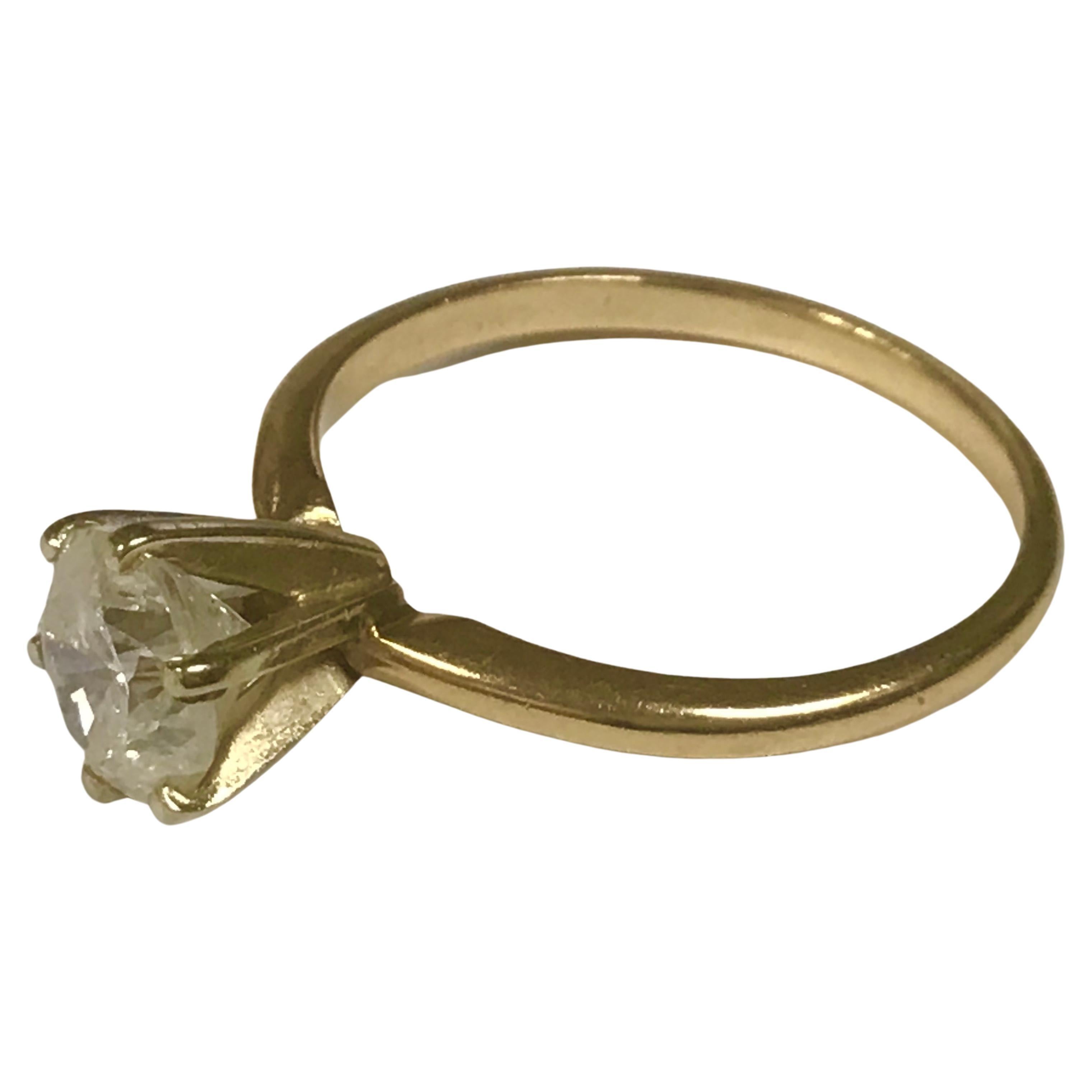 Antique 14k yellow round Diamond solitaire ring, 2.30 Grams TW. The solitaire dimensions are approximately 6.4 mm. Solitaire is approximately one carat. Tested for 14k. 
