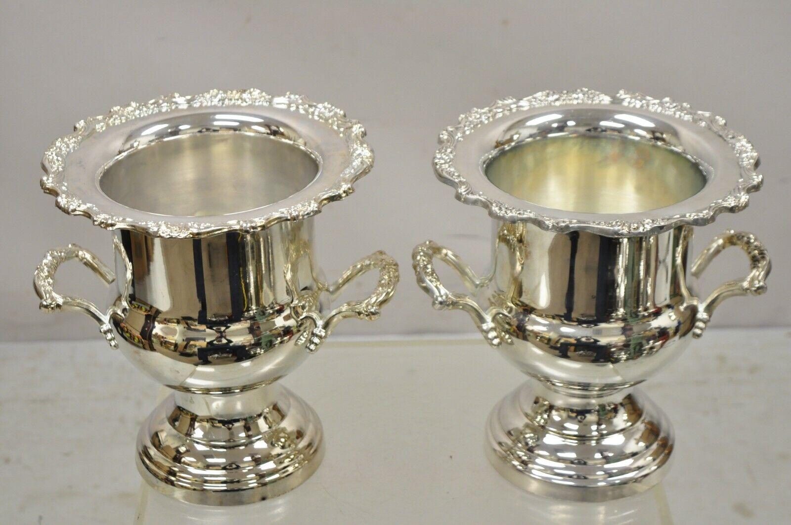 Vintage Oneida Regency Style silver plated champagne ice bucket - a pair. Item featuresOrnate twin handles, shapely 