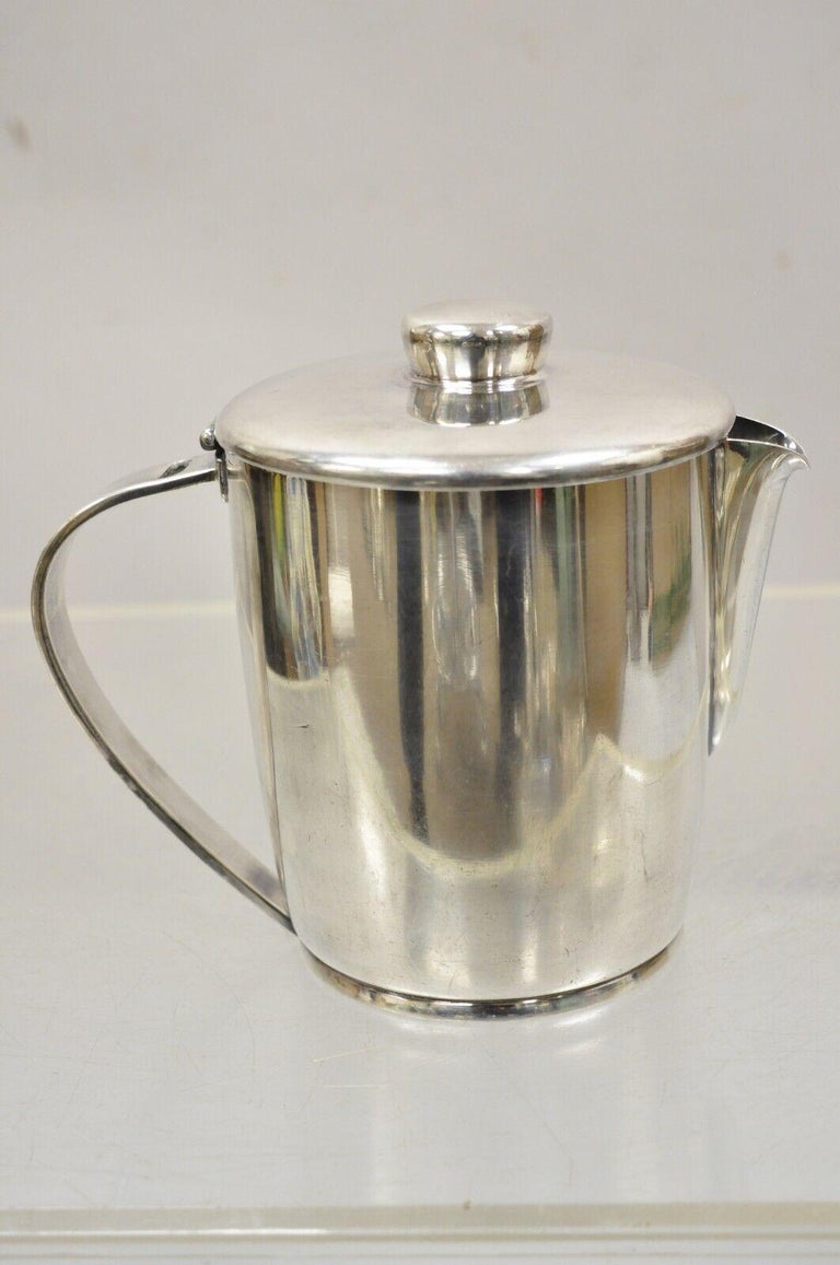 https://a.1stdibscdn.com/vintage-oneida-sambonet-italy-silver-plated-modern-coffee-pot-water-pitcher-for-sale-picture-12/f_9341/f_359818821693580598058/12_master.jpg?width=768