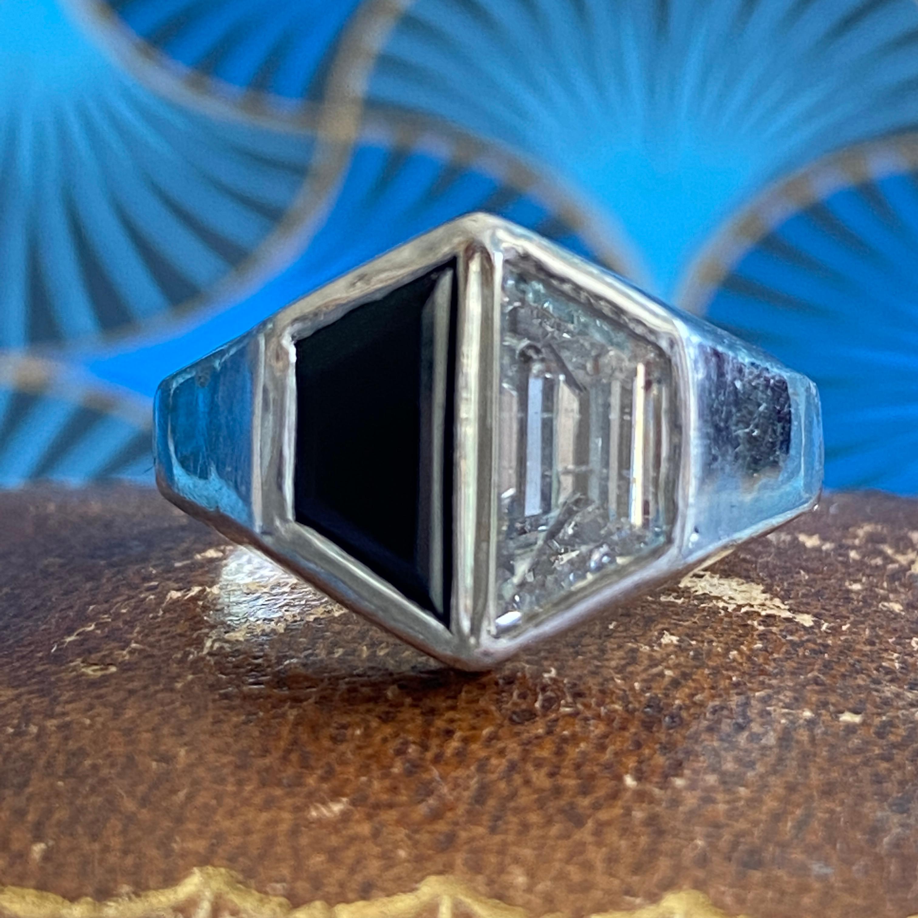Details:
Stunning vintage 18K white gold, onyx and diamond ring—would make a lovely wedding ring! The diamond is estimated 1.27 carats, and matches with the onyx. The setting is beautiful on this ring, and is in lovely shape. This is a stunning