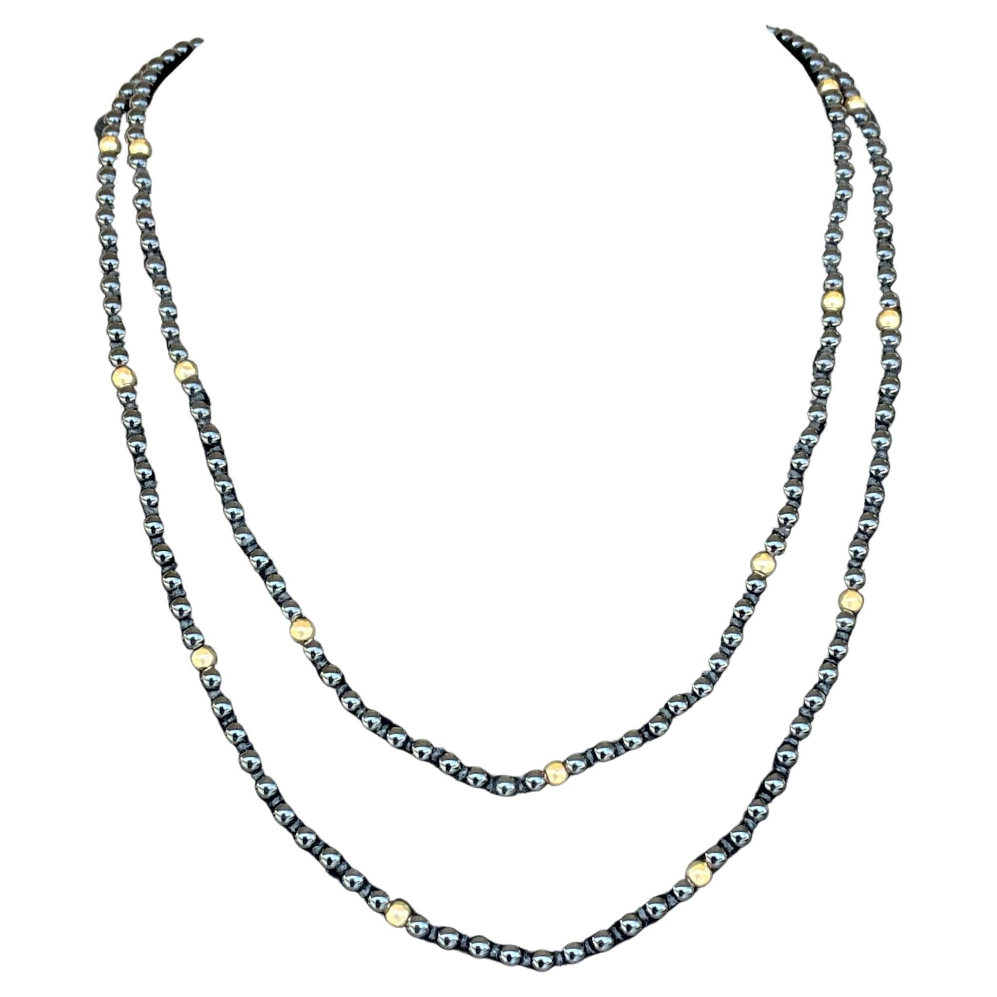 Collar vintage de cuentas de ónix y oro de 14k con cierre