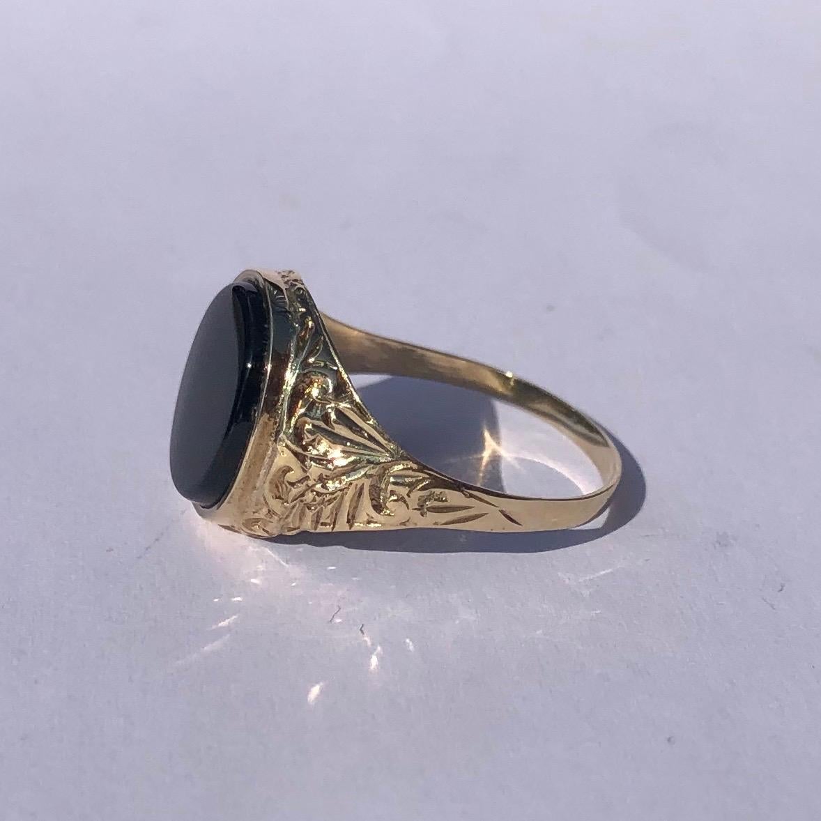 This glossy and shiny Onyx signet ring has beautifully intricate engraved shoulders. Made in Birmingham, England.

Ring Size: R or 8 3/4
Stone Dimensions: 11x9.5mm 

Weight: 2.13g
