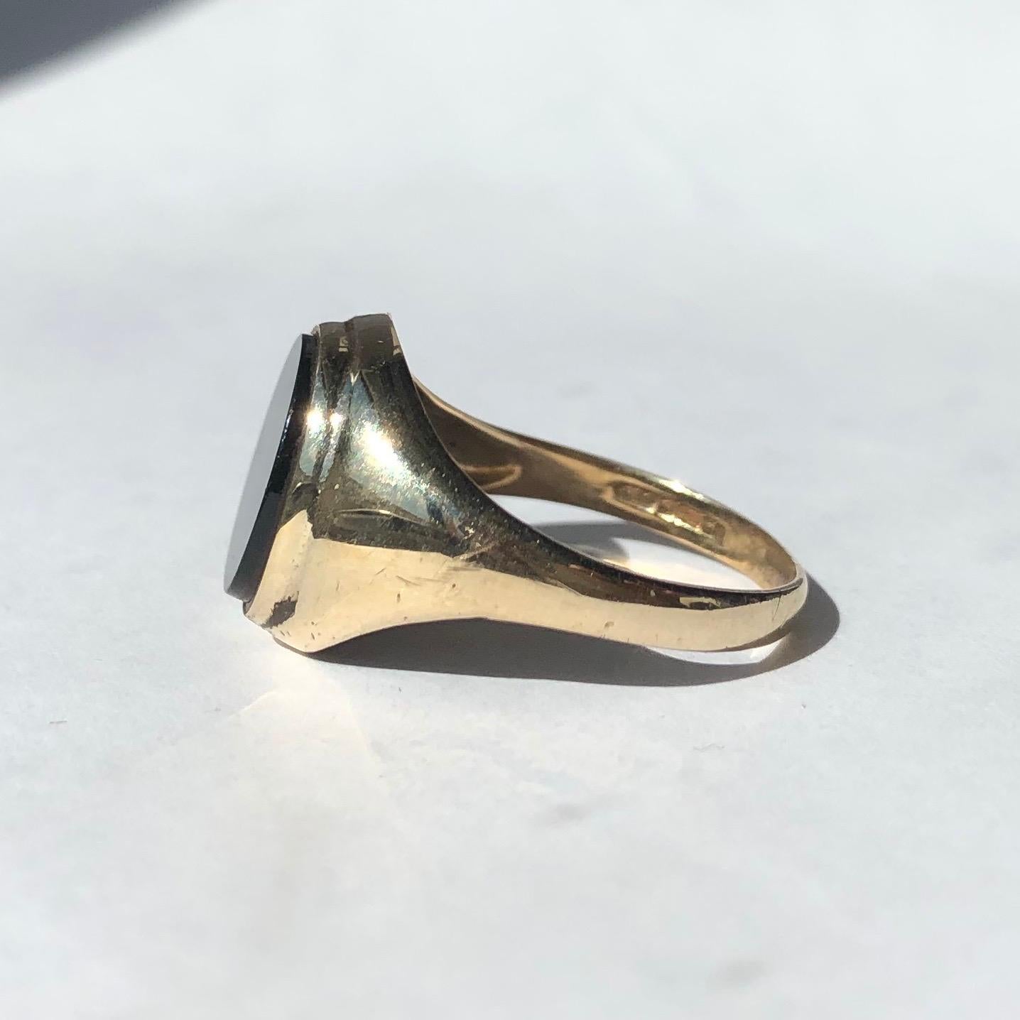 The onyx in this signet ring is in lovely condition and it so glossy! The stone is set within the 9ct gold band and this piece was made in London, England. 

Ring Size: Q or 8
Stone Dimensions: 11.5x10mm 

Weight: 2.28g