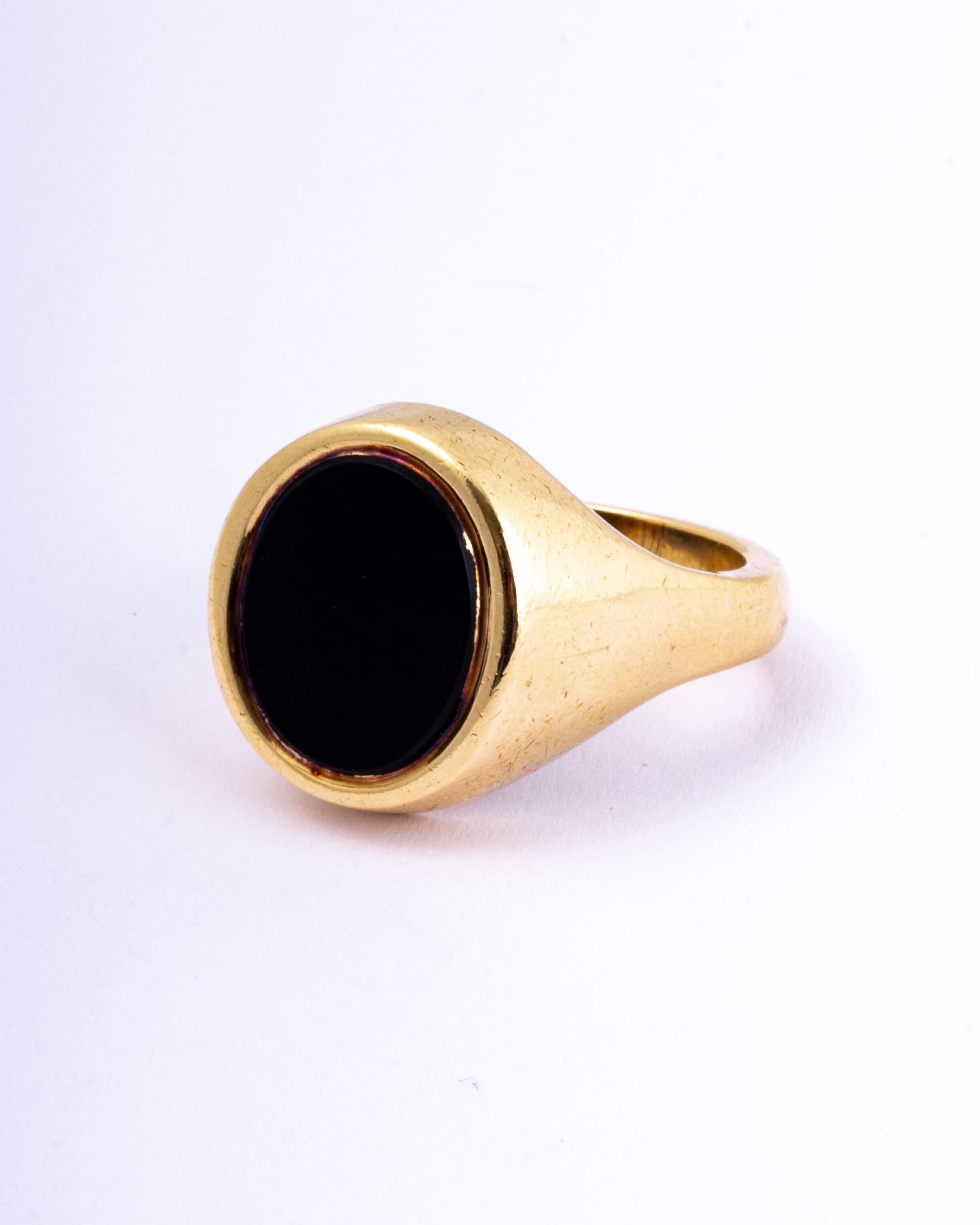 The onyx in this signet ring is in lovely condition and it so glossy! The stone is set within the 9ct gold chunky band.

Ring Size: T 1/2 or 9 3/4
Stone Dimensions: 14x12mm 

Weight: 11.1g