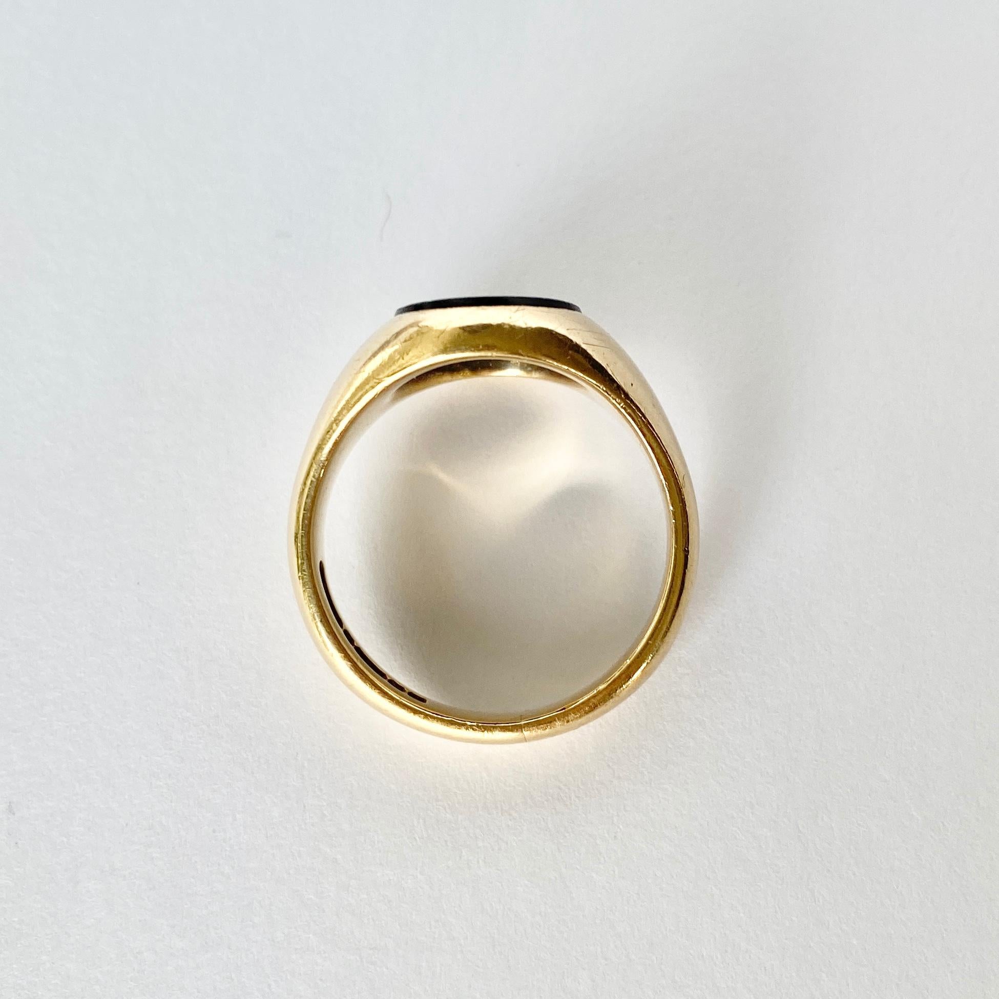 The onyx in this signet ring is in lovely condition and it so glossy! The stone is set within the 9ct gold chunky band. Fully Hallmarked Birmingham 1960. 

Ring Size: T  or 9 
Stone Dimensions: 13x11mm 

Weight: 7.8g