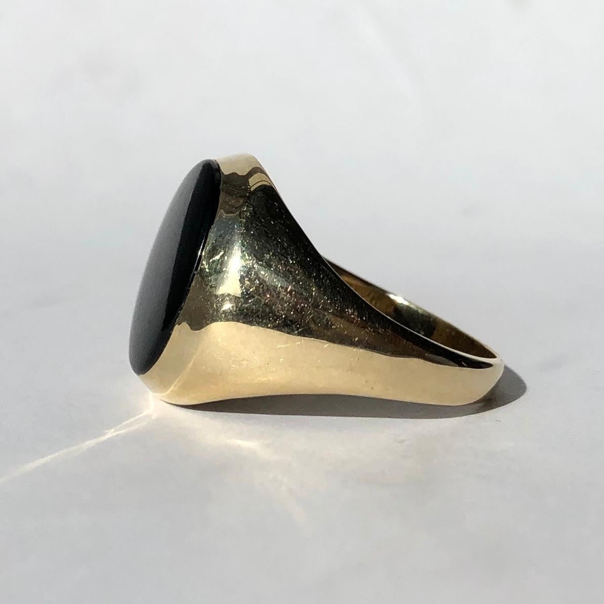 The onyx in this signet ring is in lovely condition and it so glossy! The stone is set within the 9ct gold band and this piece was made in Chester, England. 

Ring Size: Q or 8 1/4
Stone Dimensions: 12x14mm 

Weight: 3.91g