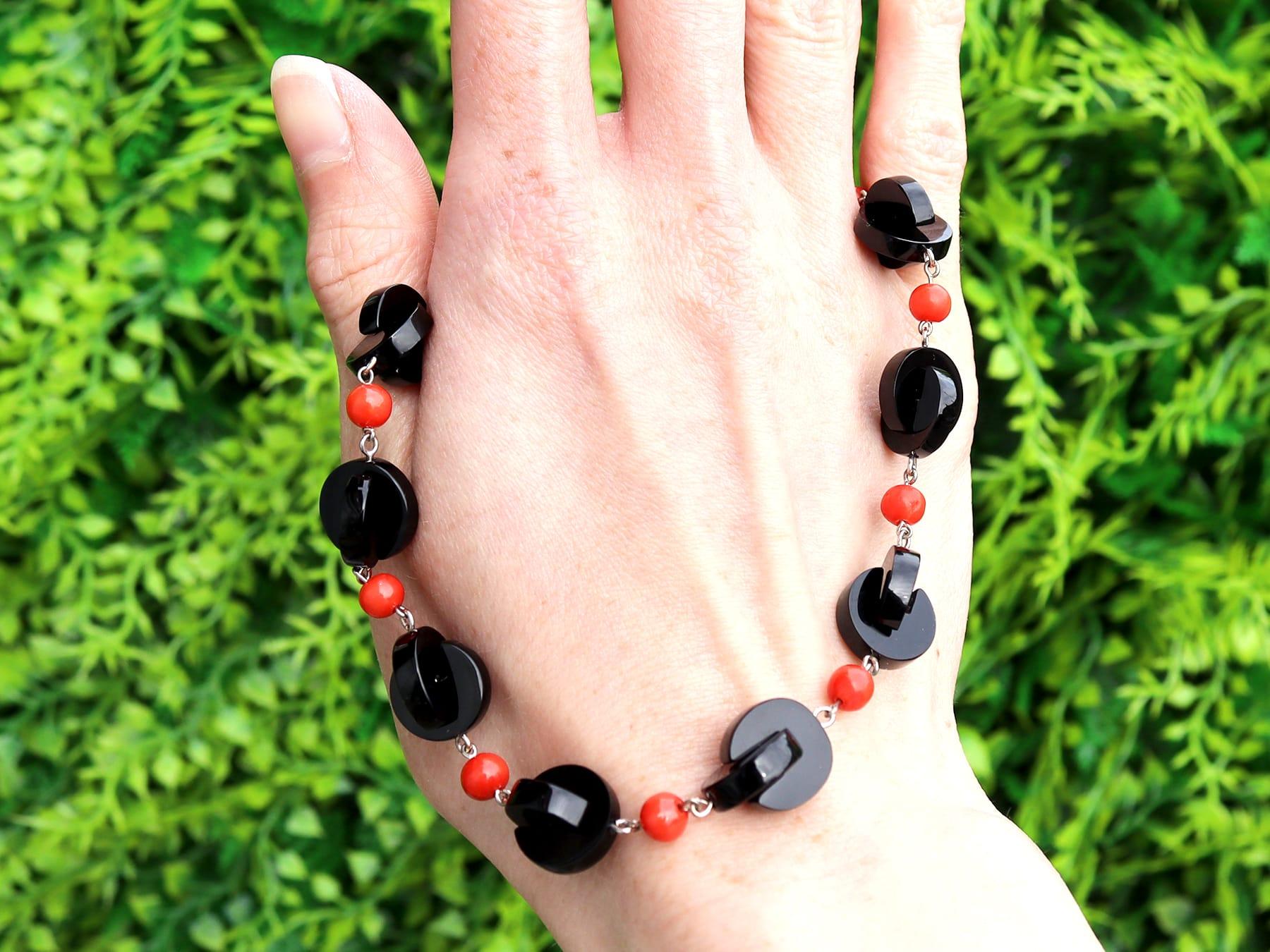 A fine and impressive, vintage onyx and 9.50 carat coral, silver necklace; part of our diverse necklace and onyx jewellery collections.

This exceptional, fine and impressive vintage necklace has been crafted in silver, with an 18k white gold
