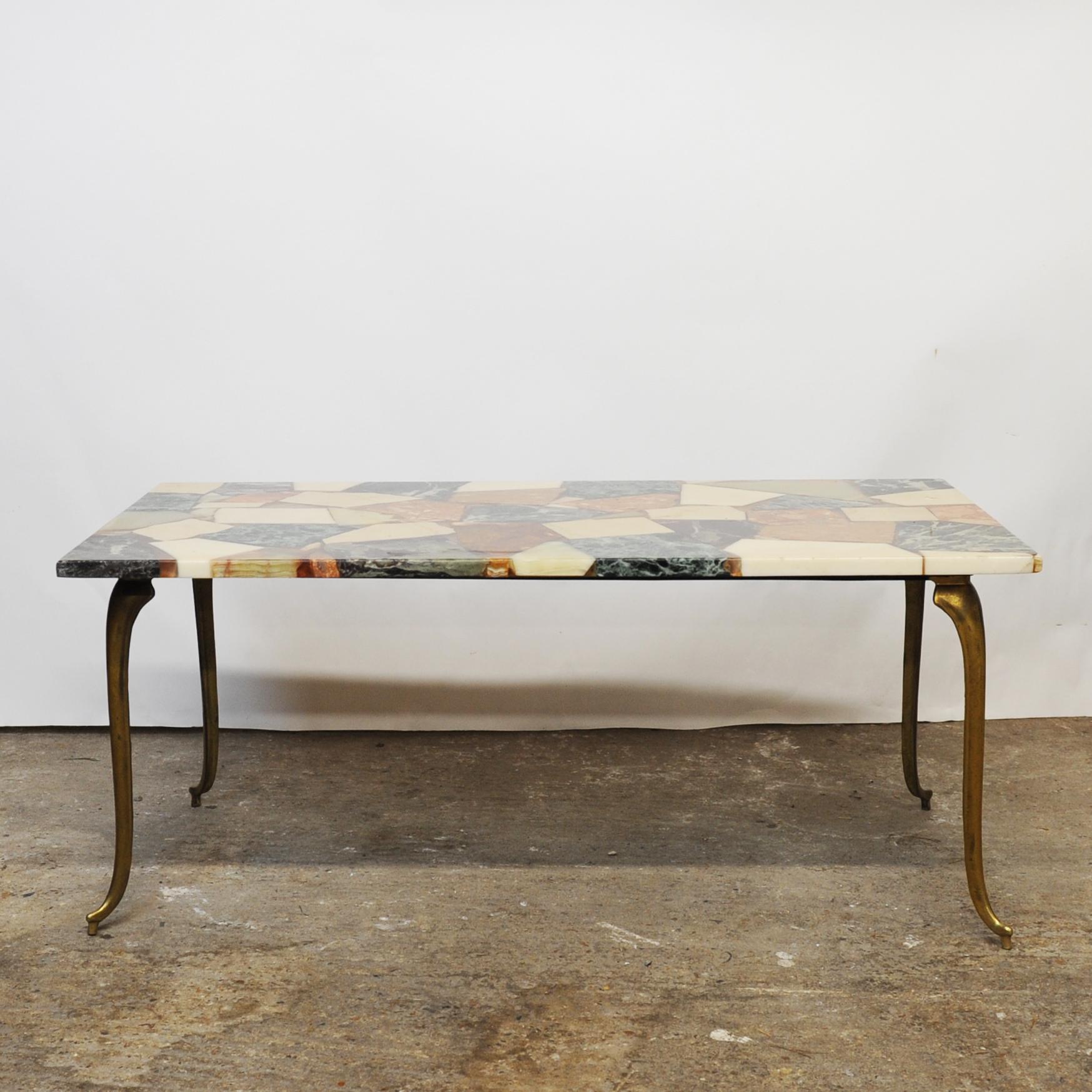 A rectangular coffee table with onyx ‘stone’ shapes with resin. The table sits on decorative brass legs.

Designer - Unknown

Design Period - 1970 to 1979

Detailed Condition - Good with minimal defects. 

Restoration and Damage Details - Light wear