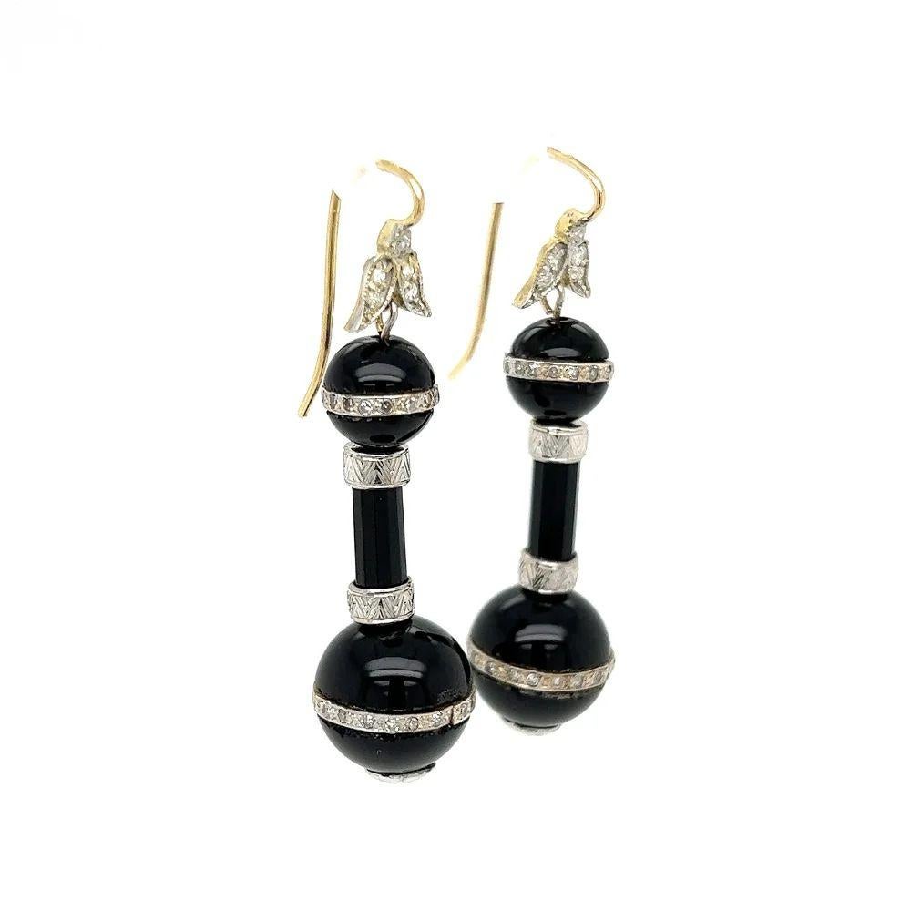 Simply Beautiful! Finely detailed Vintage Onyx and Diamond Gold Drop Earrings. Suspending Double Drop Onyx Balls, Hand set with Diamonds, weighing approx. 0.55tcw. An amazing look! Measuring approx. 1.85