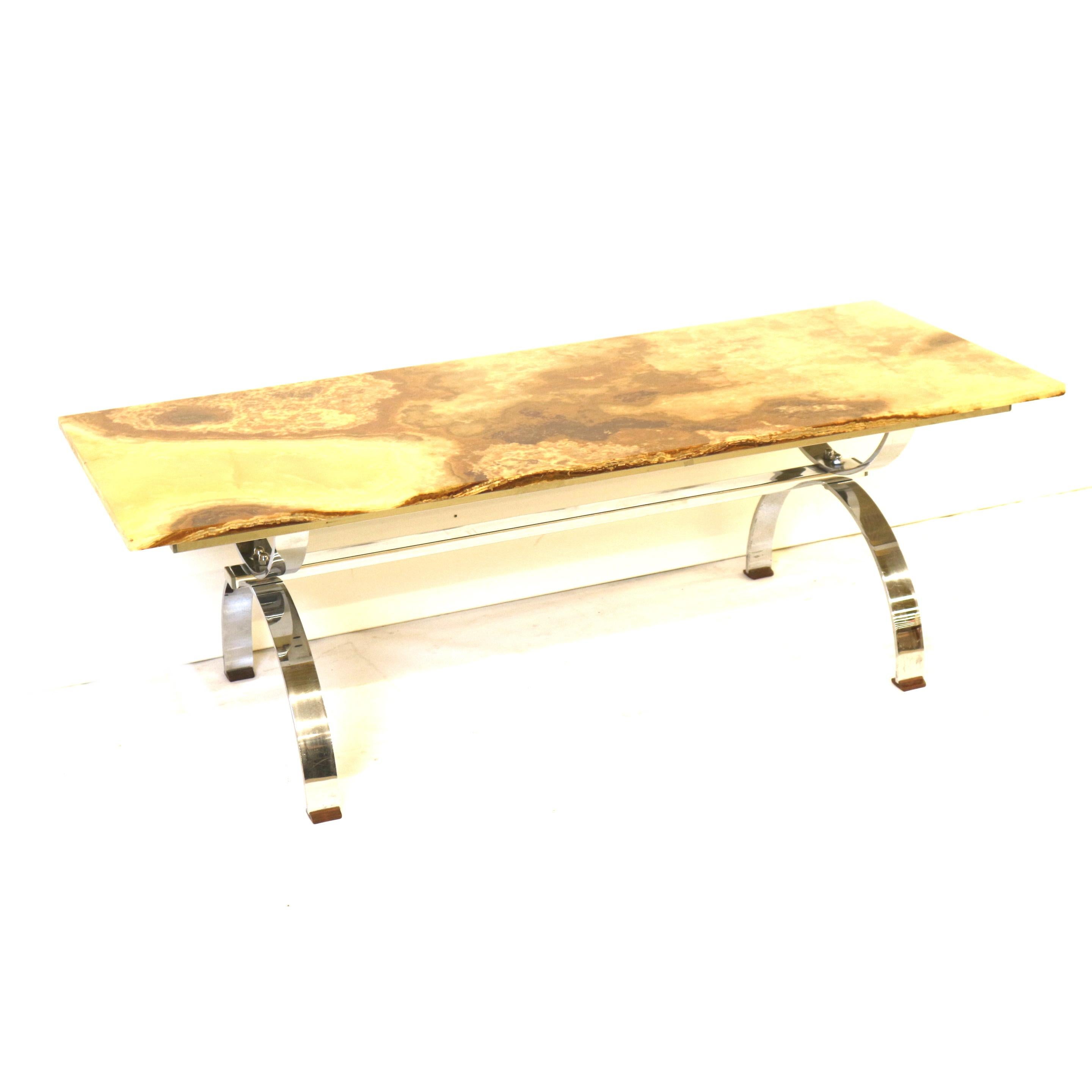 Vintage onyx coffee table with chrome base made in the 1970s.

Dimensions:
Width: 150 cm
Depth: 60 cm
Height: 49.5 cm

The table has small traces of use that match the age.