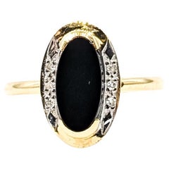 Vintage Onyx 
Diamond Halo Ring in 14k Yellow Gold