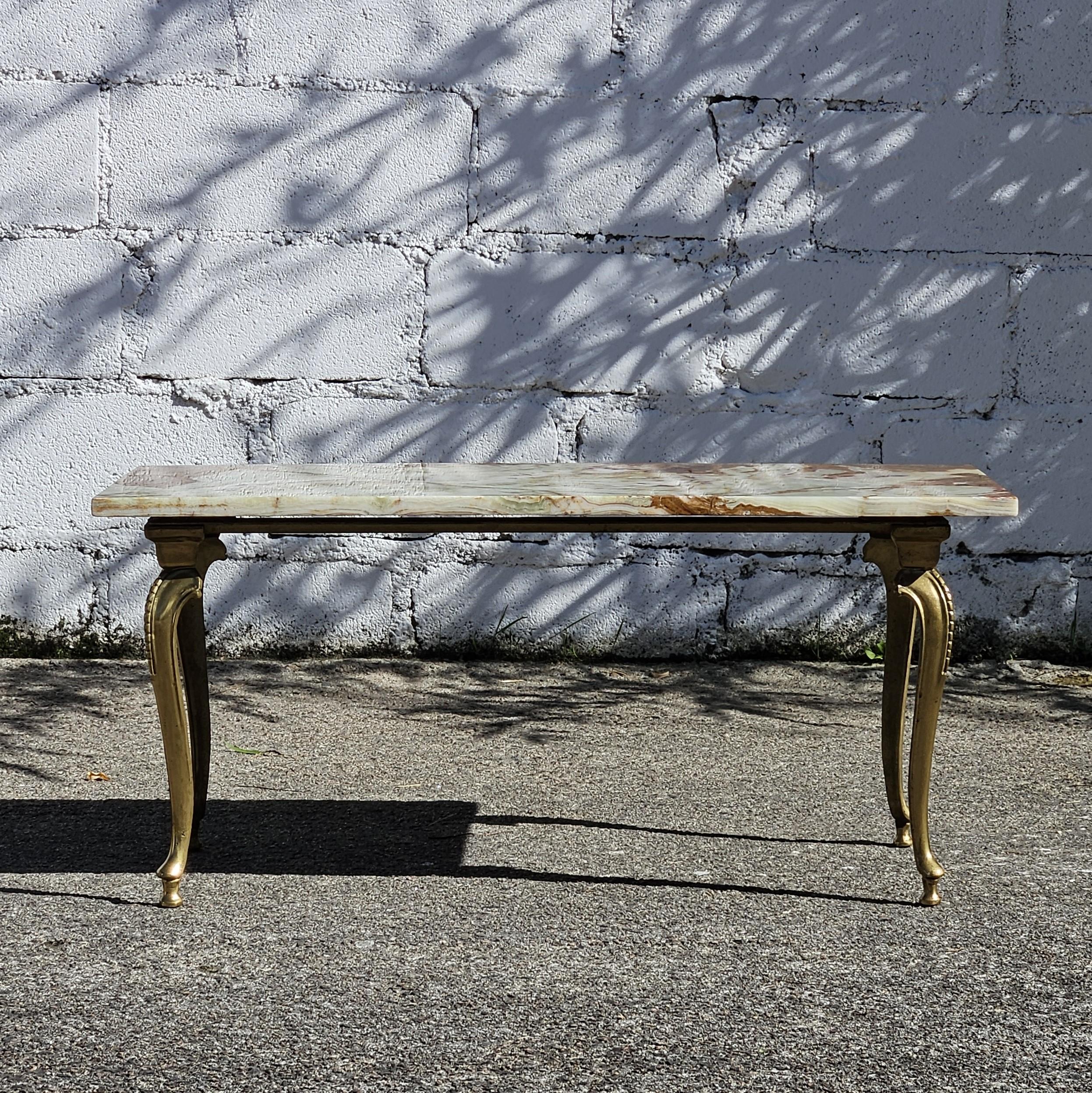 French Vintage Onyx Marble Brass Coffee Table-Coctail Table-Lounge Table-from the 60s
Massive Marble Top with natural Patterns - a wonderful Color play - Clouds of mother of pearl,jade green orange,brown and bordeaux .
Solid reinforced Steel Frame -