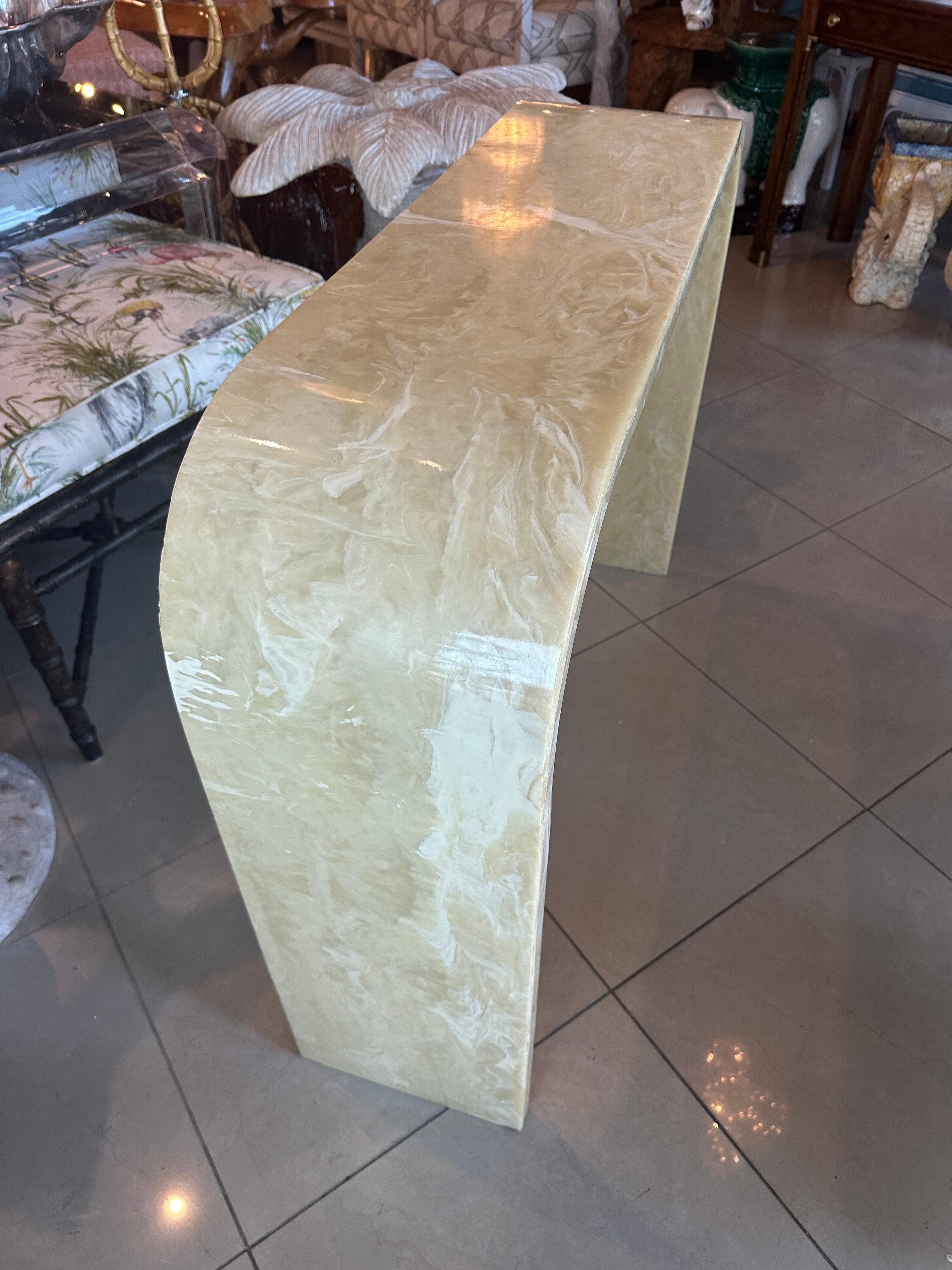 Vintage onyx marble stone waterfall style console table. Dimensions 32.75 H x 42.25 W x 11 D. Matching arched mirror will be listed separately. Heavy table. Light can shine through if you place flashlight underneath. The back side rim is not