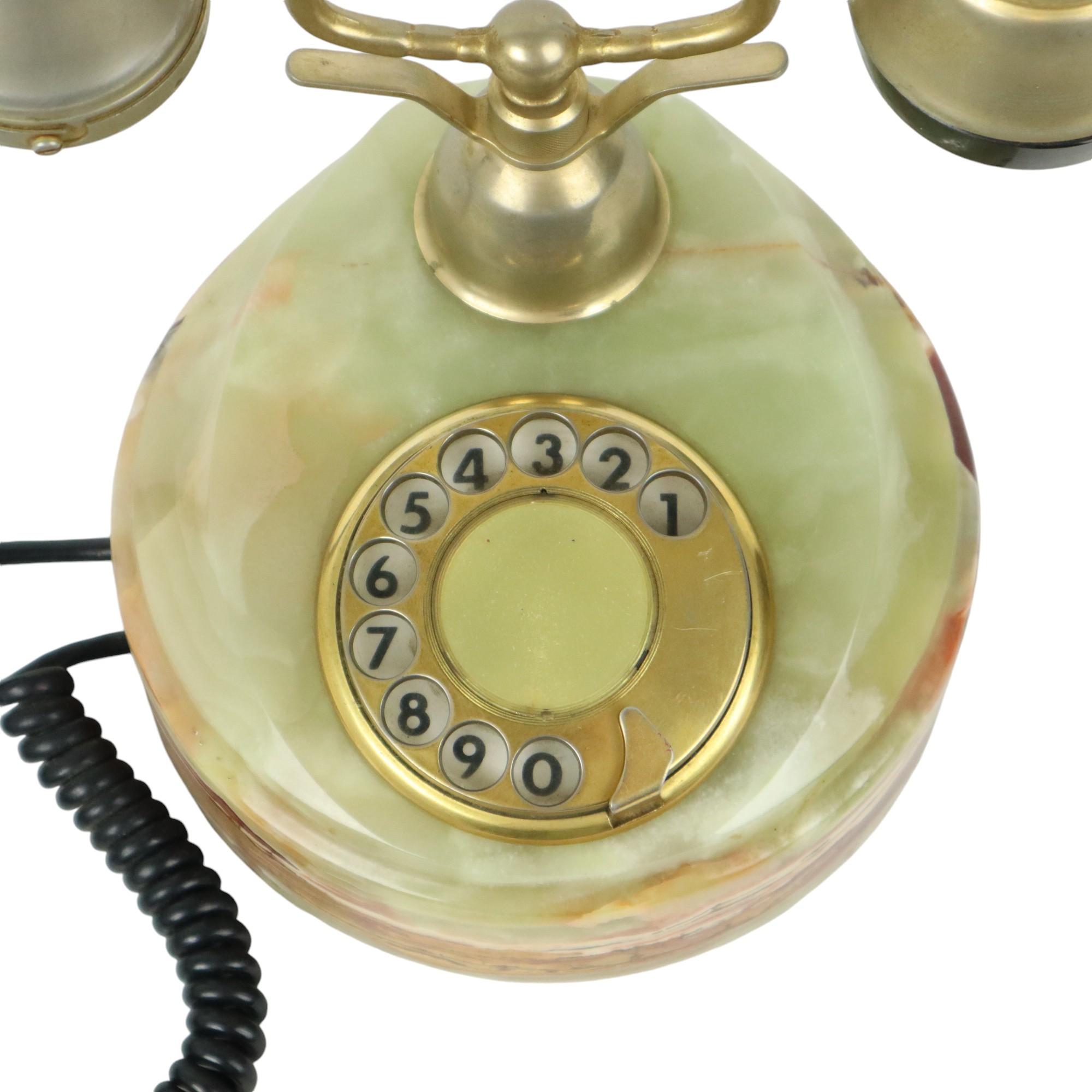 Beautiful and high-quality onyx marble rotary or dial telephone with 18 carat gold-plated elements, marked Onix Telephone at the bottom, Made in Italy, circa 1950s-60s.

Very decorative telephone, collector's item in this condition, includes a 5-pin