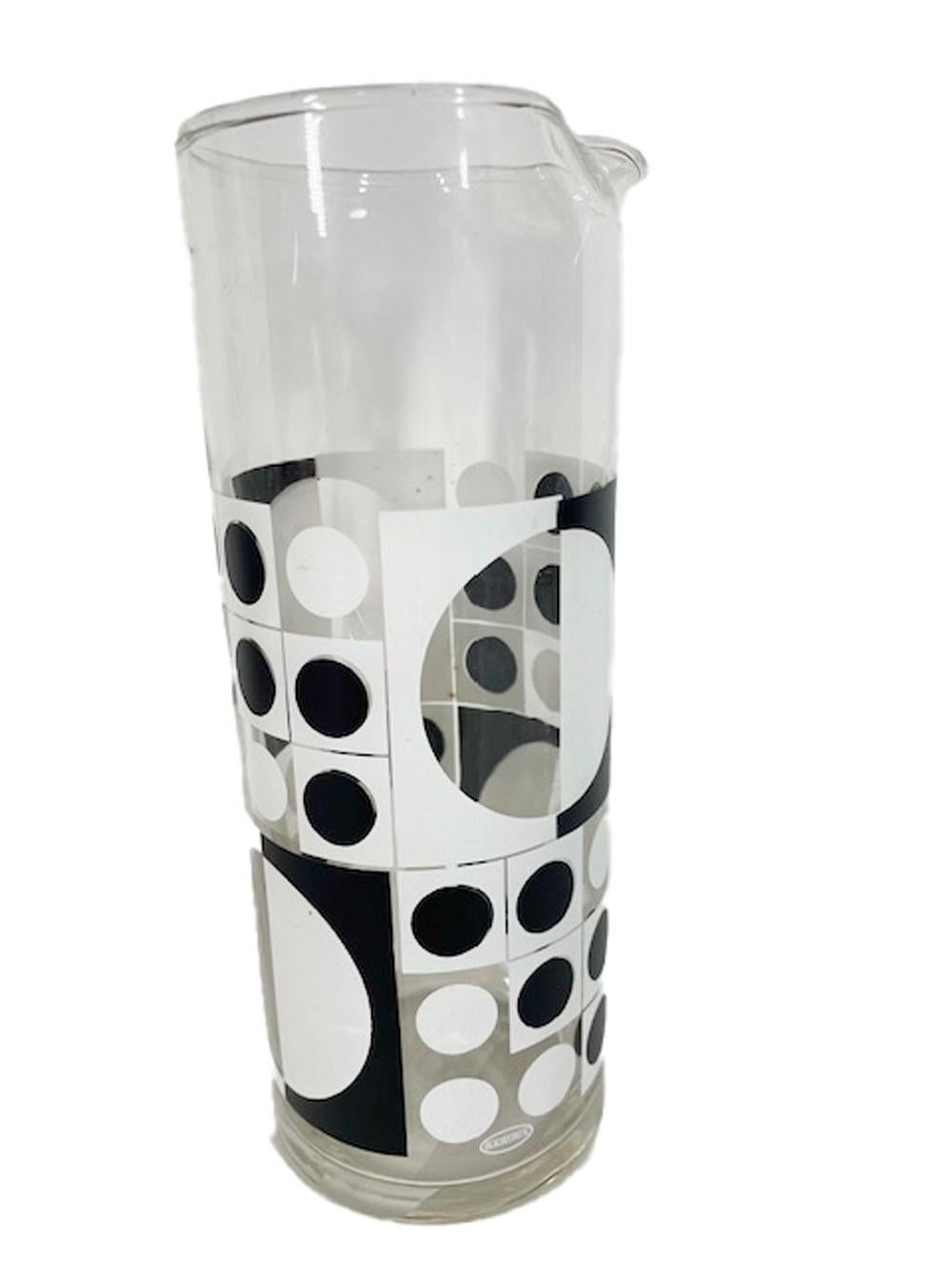 9 Piece cocktail set by Bartrix / Cera Glassware in a black and white Op-Art Verner Panton style design. Included are six stacking rocks glasses and a cocktail pitcher along with an oval vinyl clad cheese board with ceramic tile insert and cheese