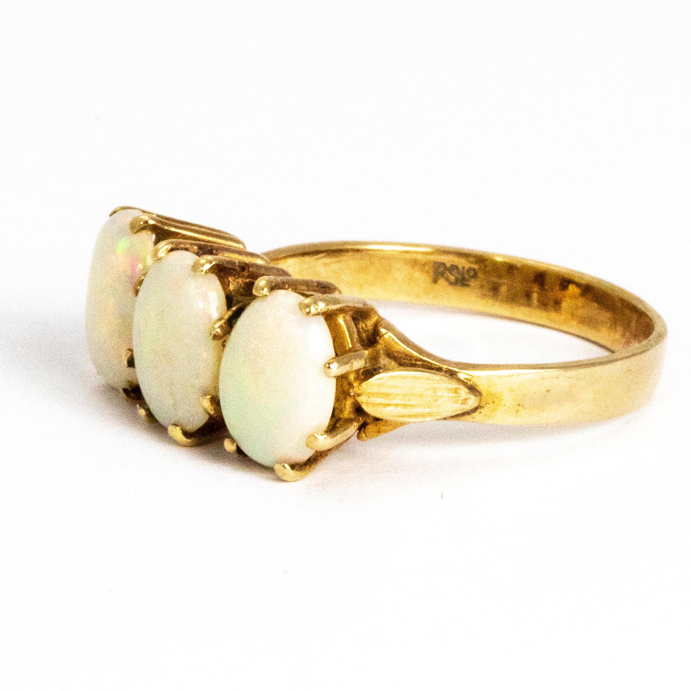 This three stone ring is rather stunning! It holds three lovely, large oval shape opals held in tall open claw settings. This iridescent stunner is modelled out of 9ct gold and made in London, England.

Ring Size: Q or 8
Ring Width (widest point):
