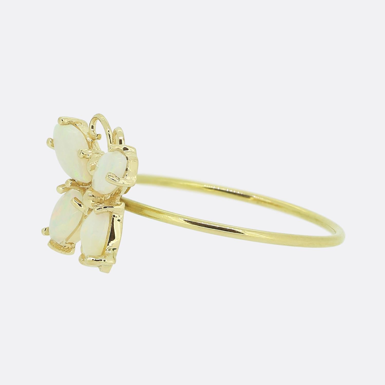 Here we have a fun vintage butterfly ring. The butterfly features four well matched white opals which play the part of the wings with the anntennae and body being crafted from a warm 9ct yellow gold. 

This piece started life as a vintage stick pin
