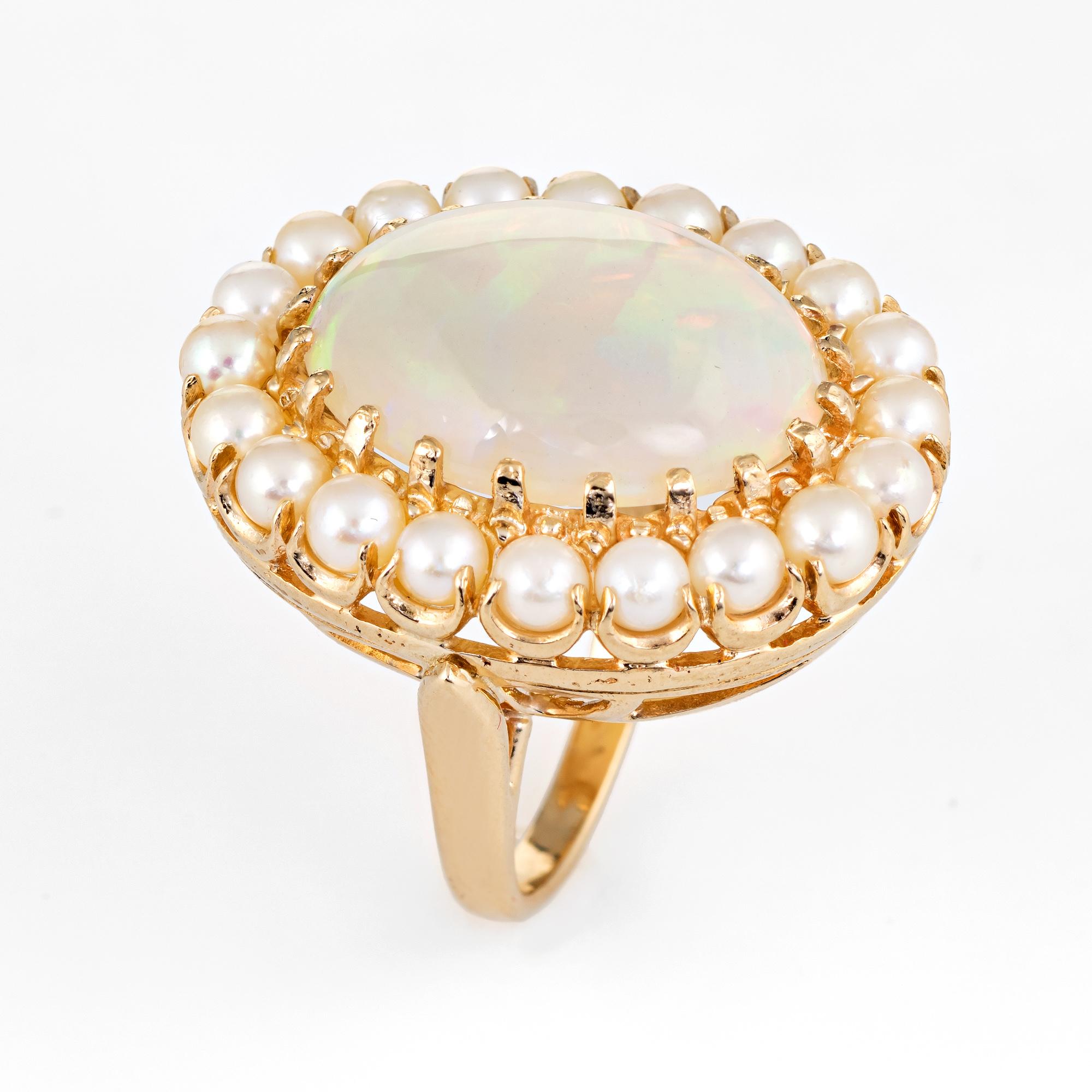 Elegant vintage opal & diamond ring (circa 1950s to 1960s), crafted in 14 karat yellow gold. 

The opal measures 19mm x 15mm (estimated at 8 carats), accented with 20 x 3.5mm cultured pearls. The opal is in excellent condition and free of cracks or